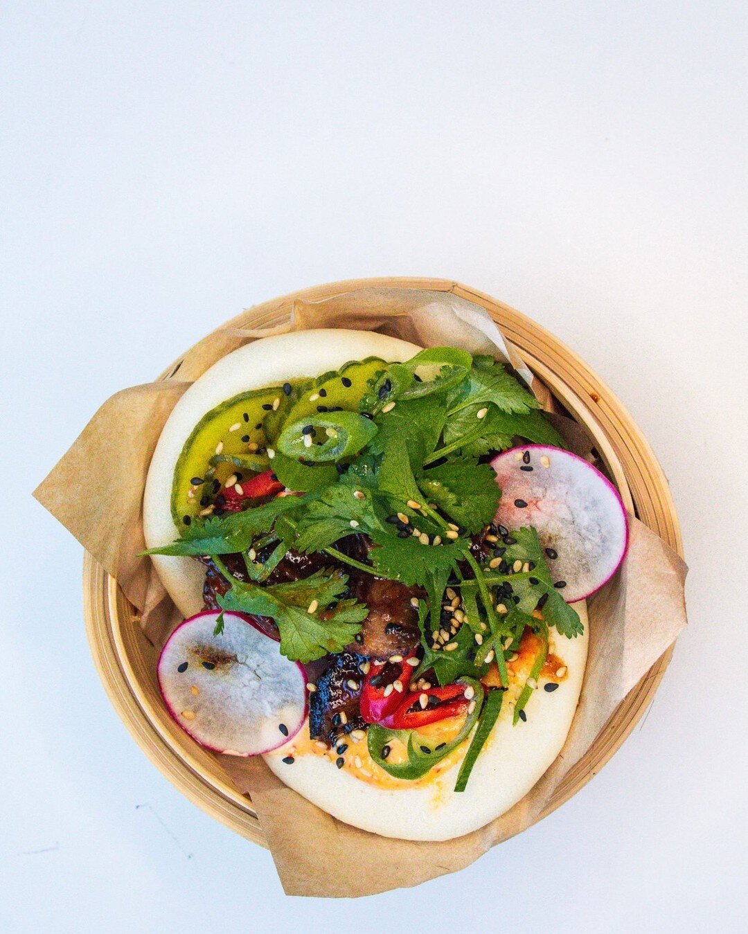 Bao bun - a trendy dish full of flavour!😋

The bao on this list is stuffed with smoked pork neck, pickled cucumber and smoked ginger-hazelnut sauce, NAM! 
(Ask my&ou