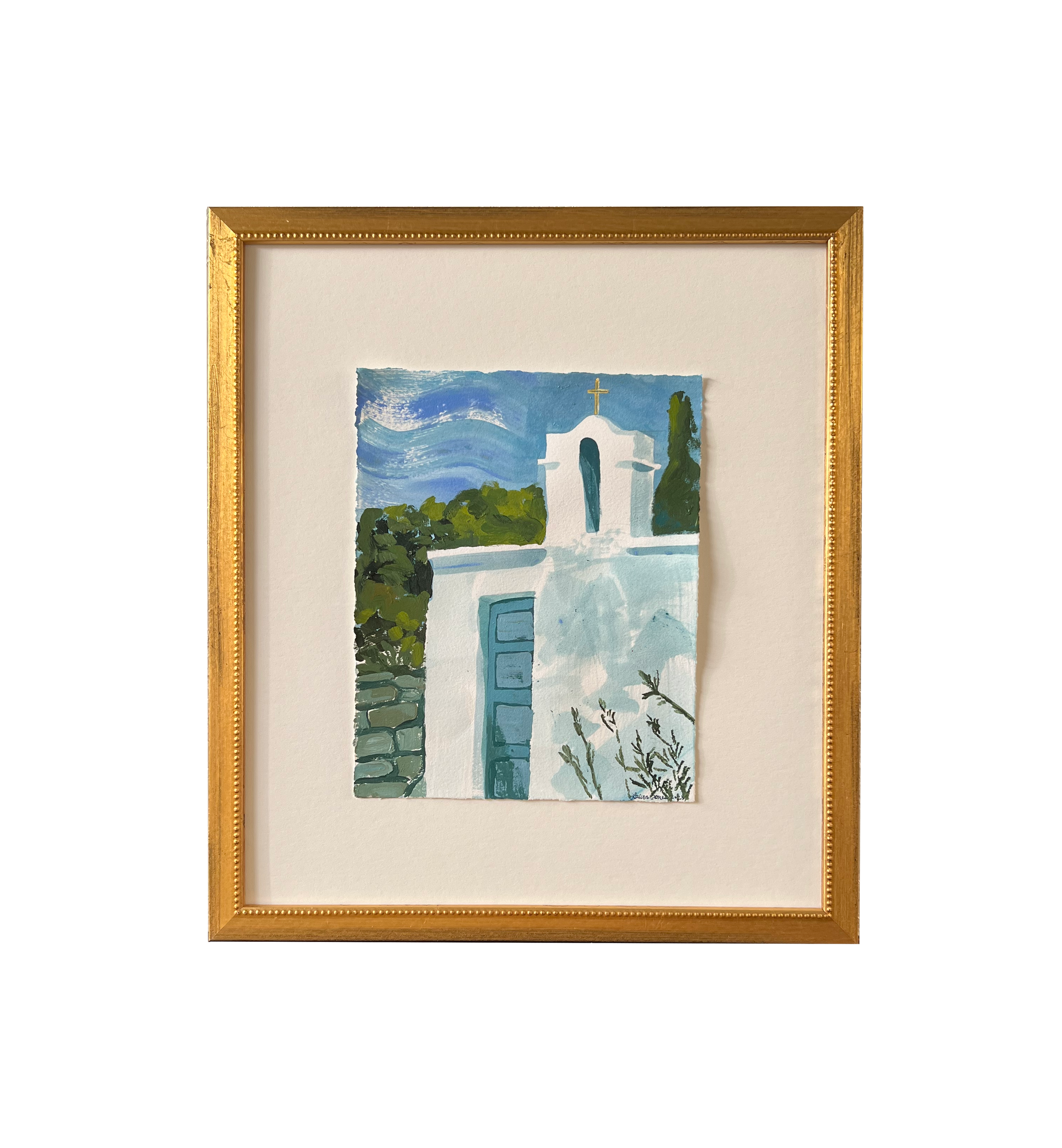 Framed painting of a white church with a blue door and cross, surrounded by greenery and a blue sky.