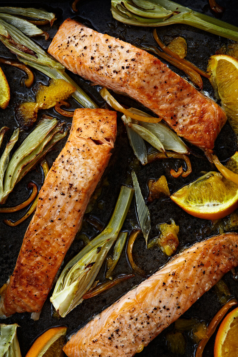 Roast baked salmon shot for a recipe book. Shot by food photographer and tabletop director Scott Grummett based in London. Fish tray bake