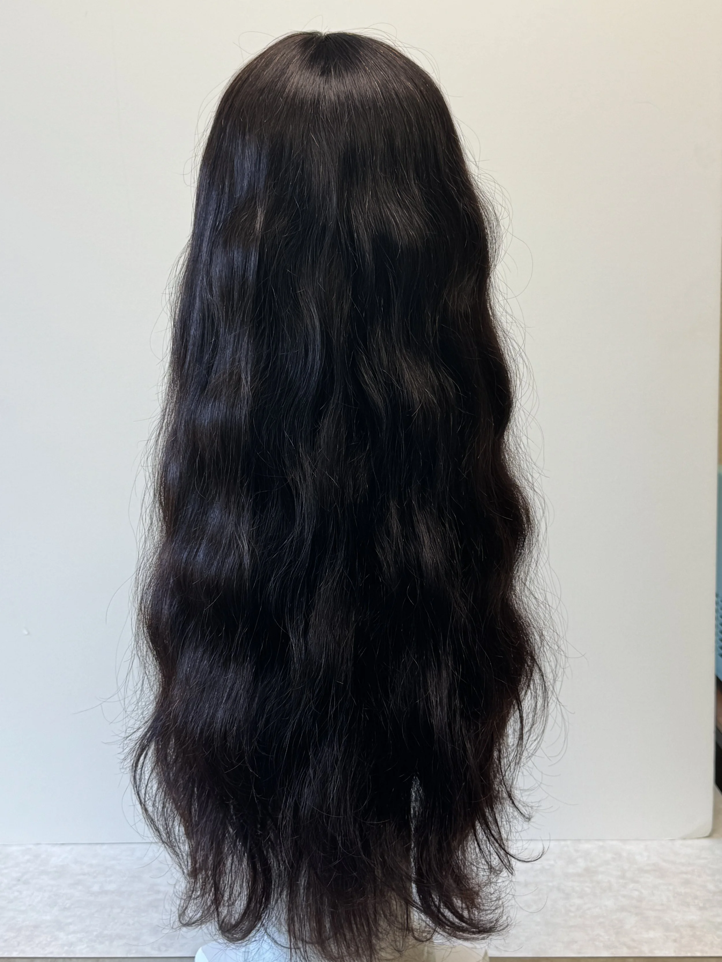 back view of a 24-inch natural-color Virgin Human Hair wig showing full bangs, long hair length, and natural texture..JPG