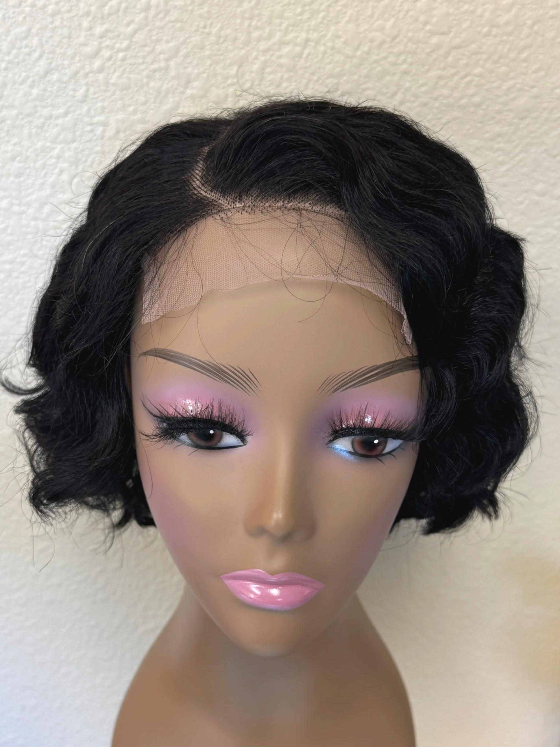 over+the+top+natural+black+1B+human+hair+bob+wig+with+soft+loose+waves+and+rounded+volume+around+the+face..png