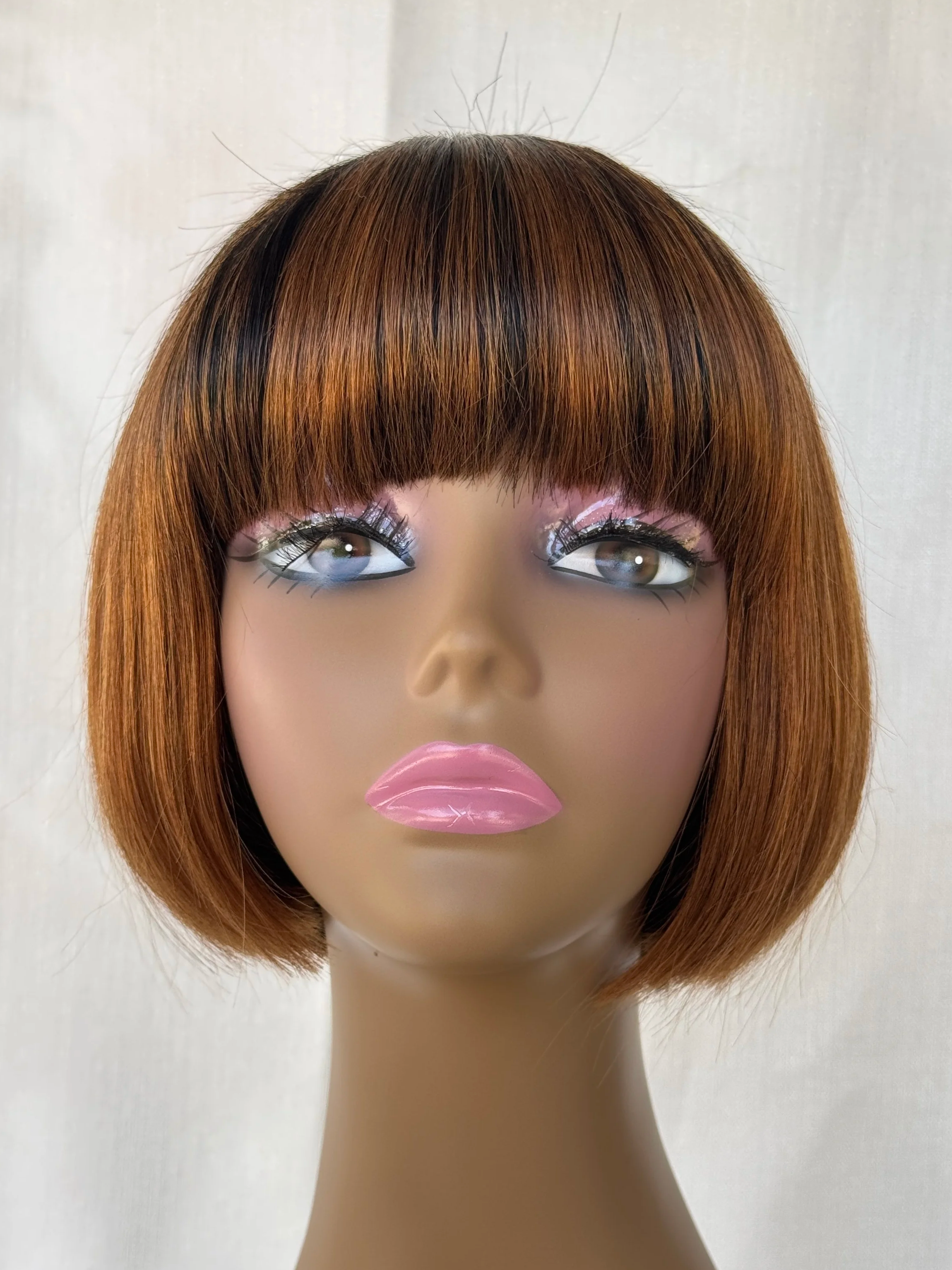 1b-30-light-auburn-rounded-graduated-bob-human-hair-wig-model-side-offblackhair.png