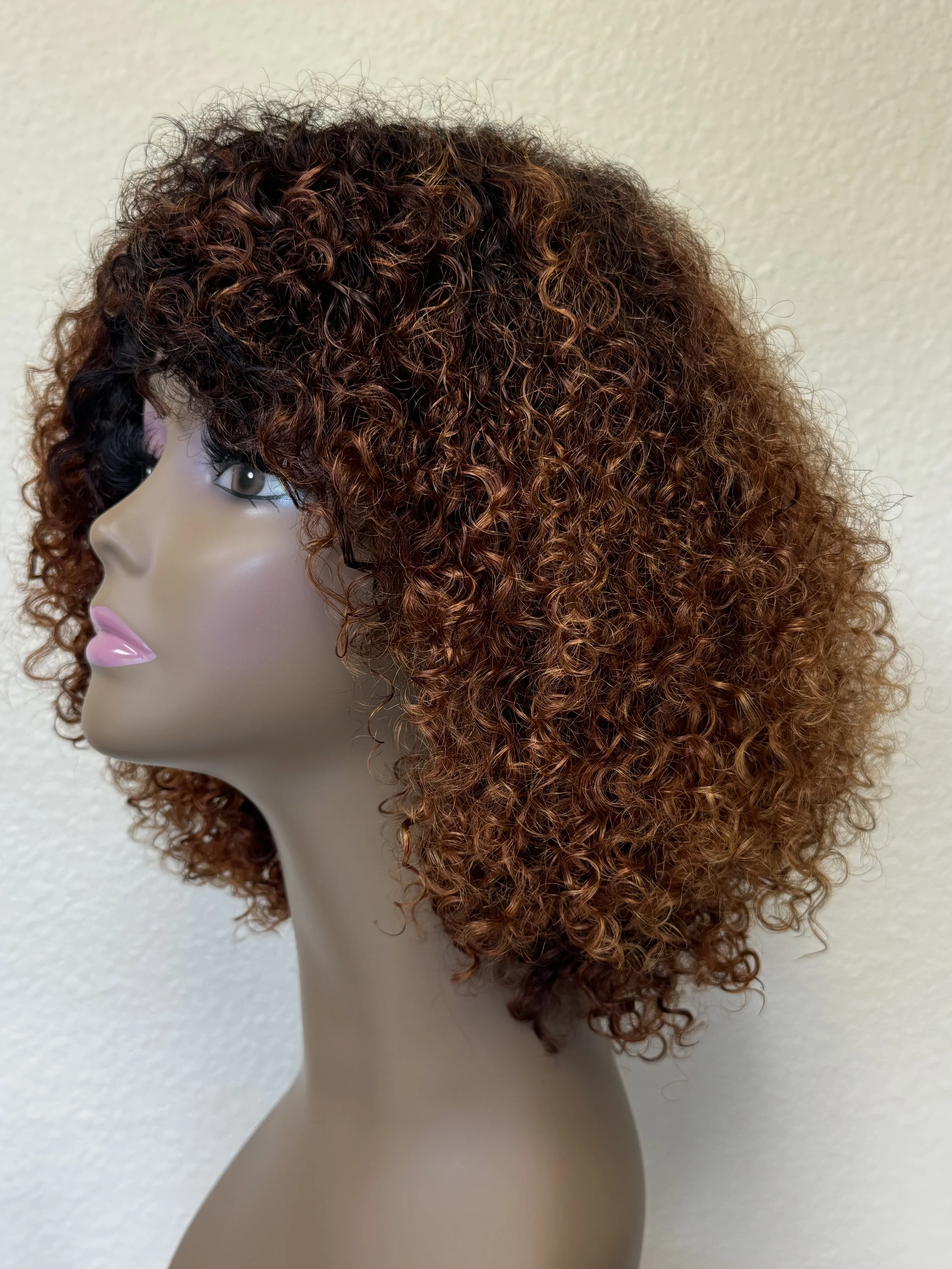 Side view of a full Burmese curly wig in warm 1B/30 ombré fall color..JPG