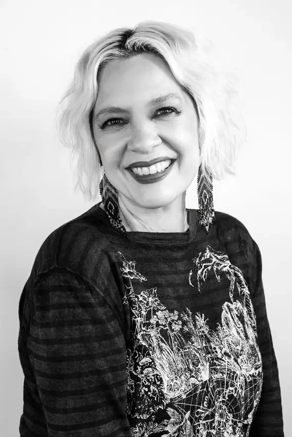 Professional headshot of JoJo, a master hairstylist at Cristophe Salon in Beverly Hills, specializing in precision hair cutting and styling.