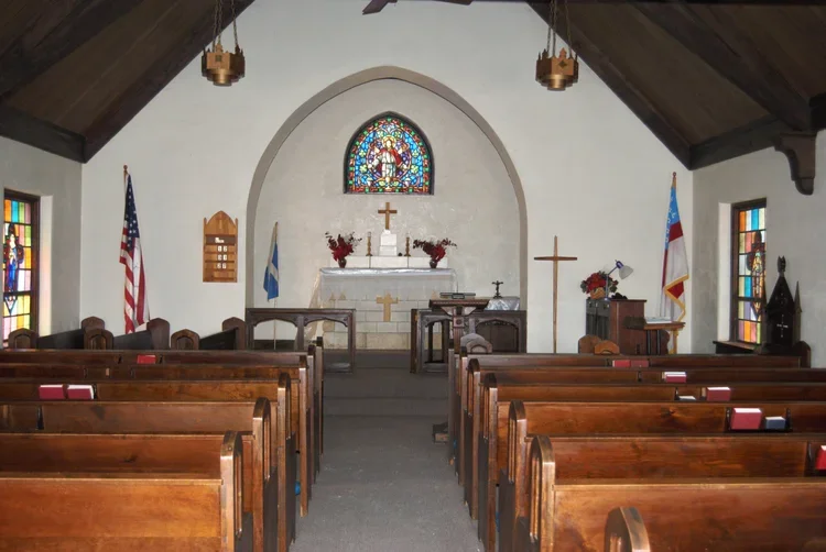 1934 -
The building cost $5,000, all of which was donated by its members. The church is English Gothic style and seats 125 people. The architect is Shaver and Co of Salina. A man named Butcher from Russel did the masonry, though the families brough