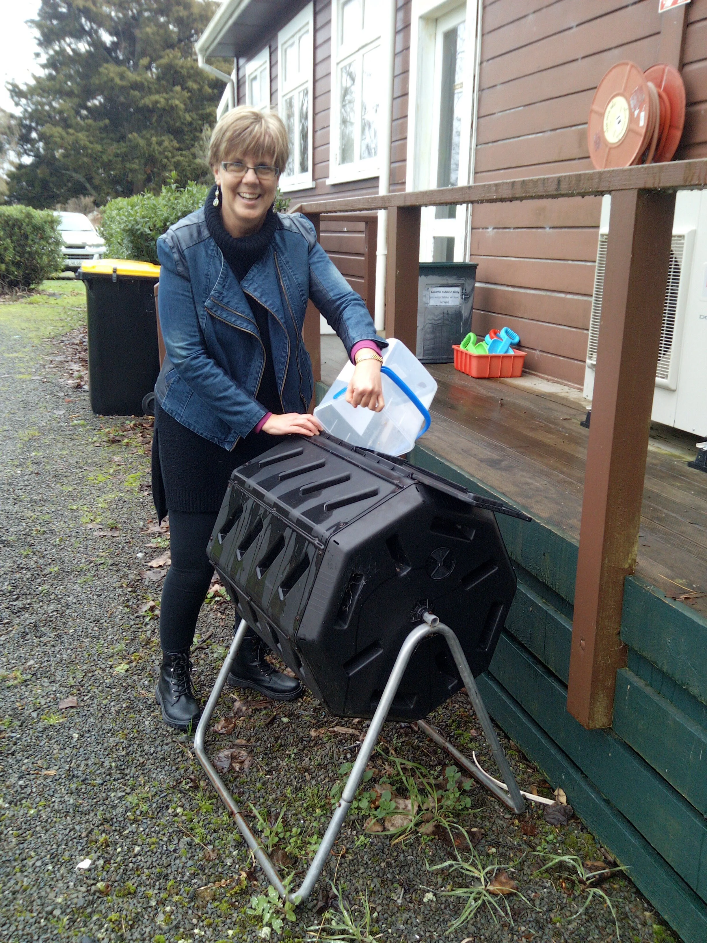 Then emptying out the food scraps into the compost bin.