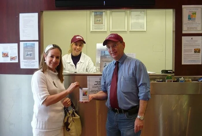 Eric Silver, Manager at Solomon Kosher Butcher and a friendly customer, Mrs. Sheiny New.