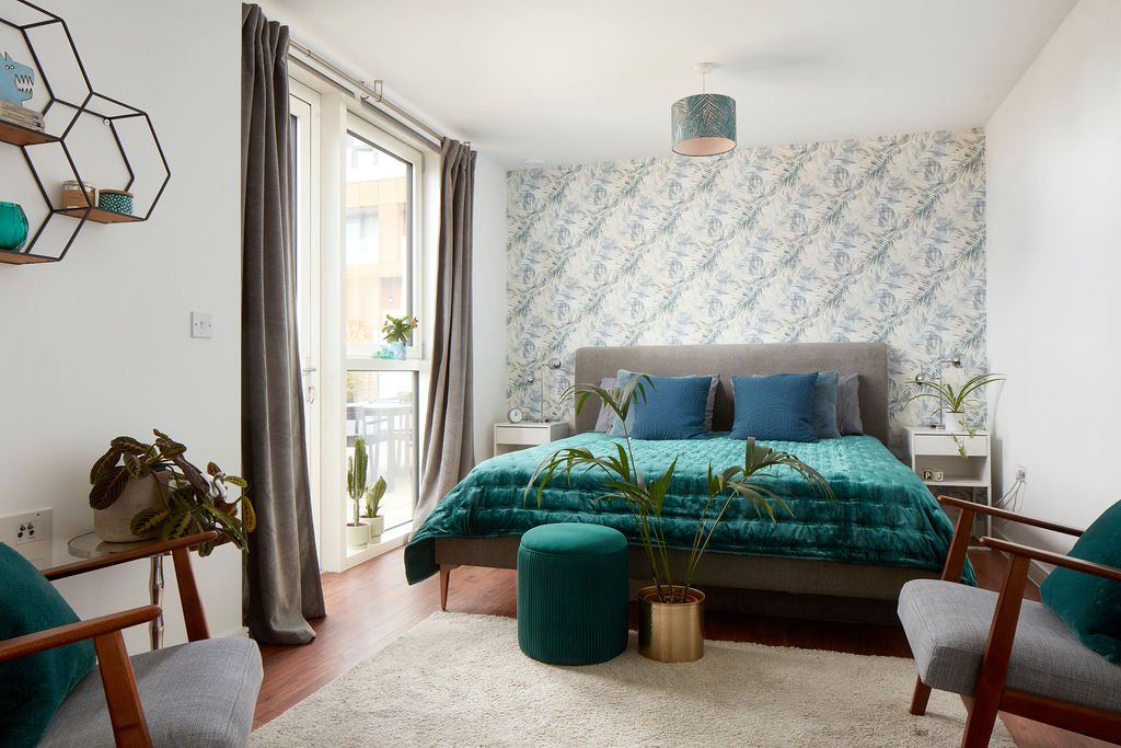 Master Bedroom with biophilic interior including earthy tones and palm leaf wallpaper