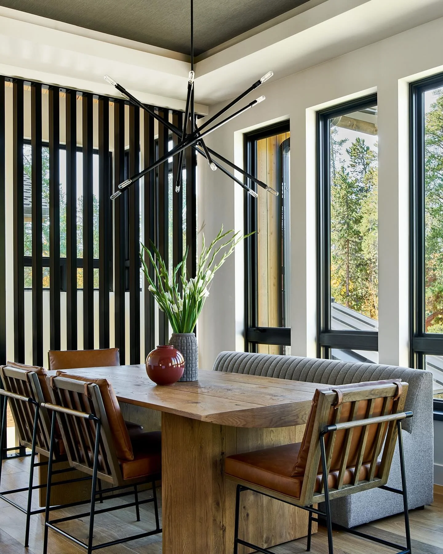 A cozy yet light filled place to gather.  Entertaining here is comfortable and shows off the mountain view.  We added some extra color and elegance to the recessed ceiling details with grass cloth wall covering.  #ibddesignstudio