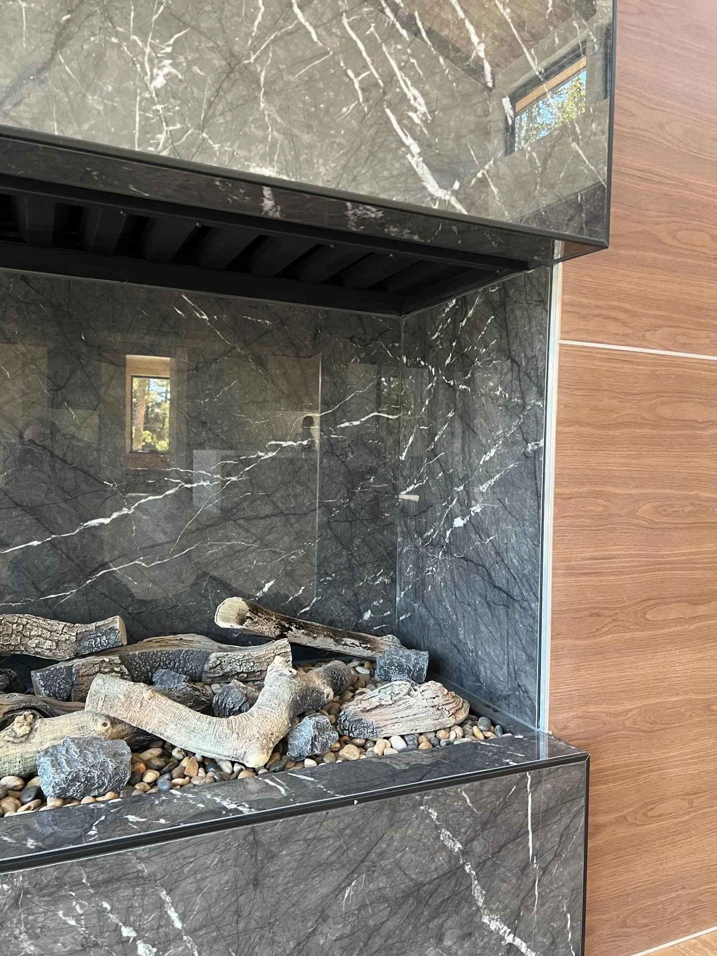 We spend many hours getting into the details and nuances of fireplaces.  The centerpieces for the home and where we gather to share stories and time.  The material is wrapped into the open gas fireplace as around the facade creating a monolithic and 