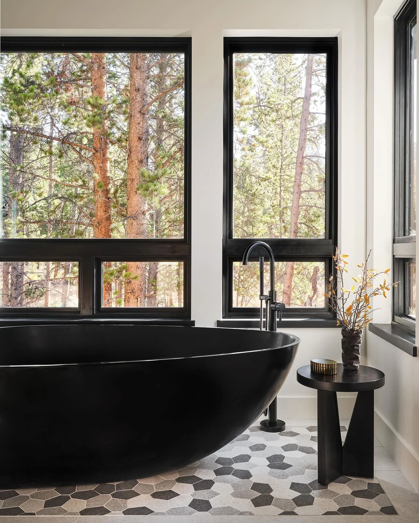 This tub is a statement piece and maybe the whole house should have been built around it as the builder might suggest next time!  Despite it being large and in charge it delivers a solid base for the neutral mosaic tile and is surrounded by private n