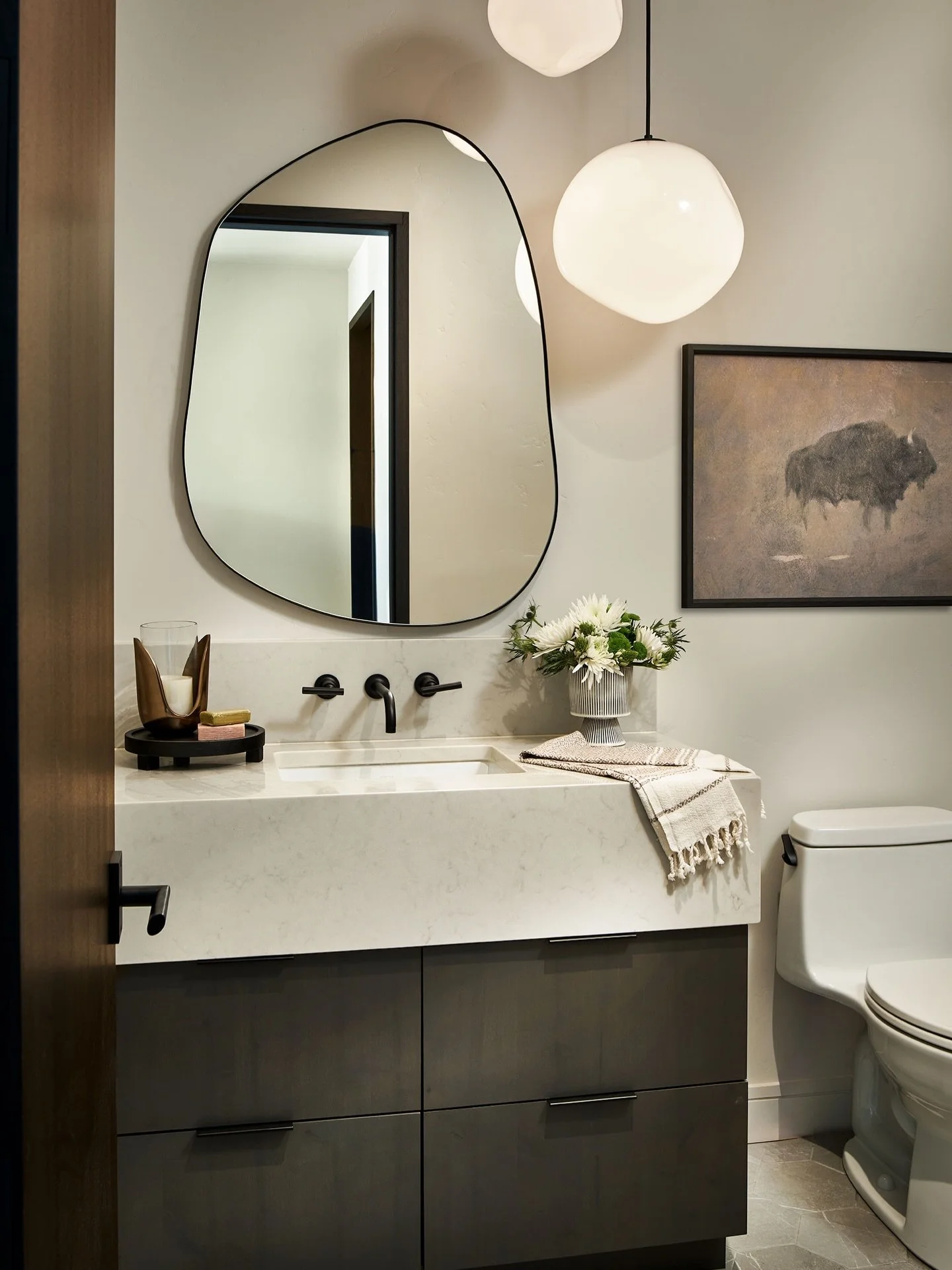 Change up the ordinary- think organic shaped mirrors, thick countertops, oversized lighting.  #ibddesignstudio