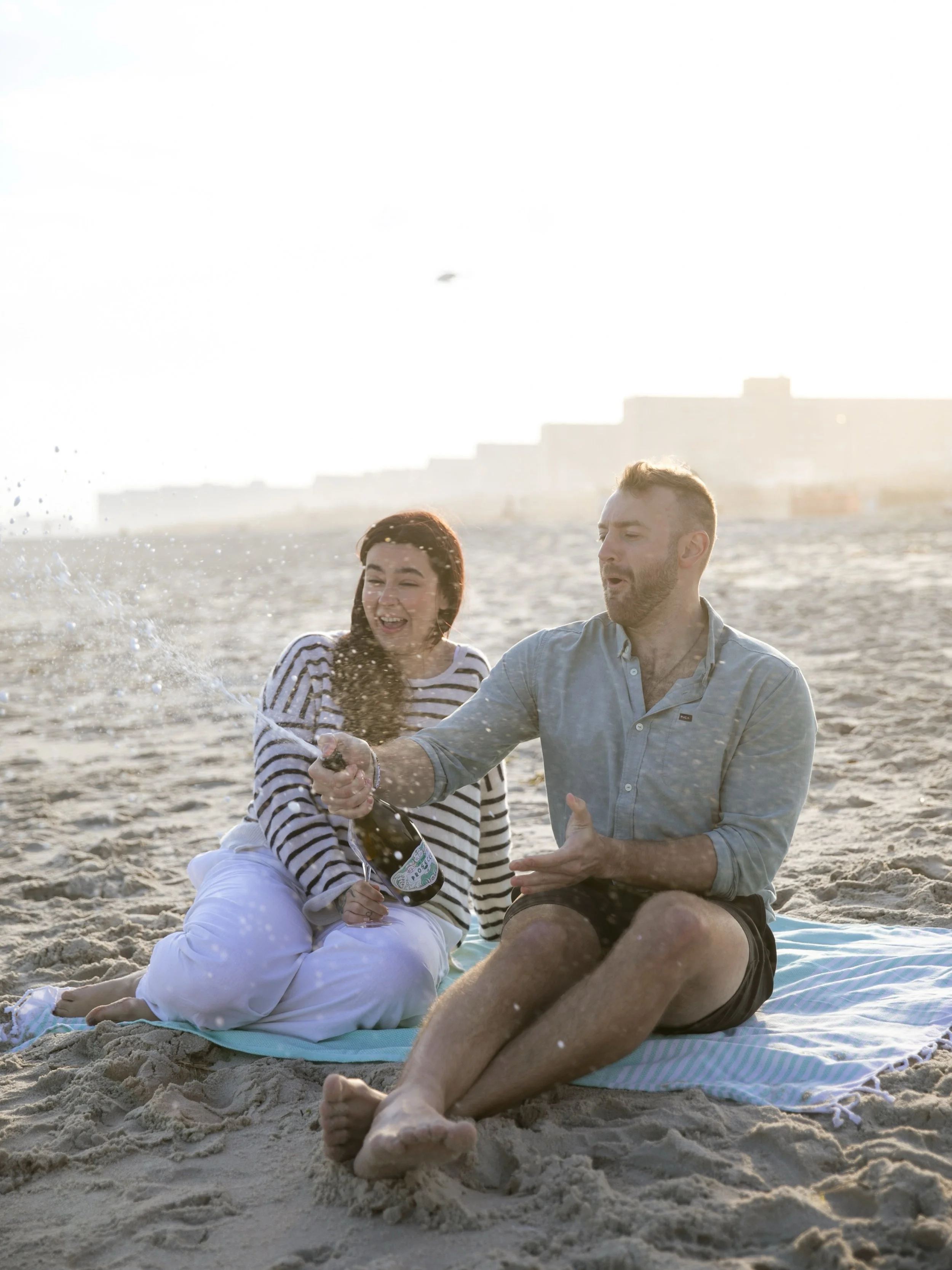 Allie &amp; Damin&rsquo;s engagement session spent at a place they love most-the beach! What an honor to get to photograph my family and their big milestones. Cheers 🍾 
.
.
.
.
.
.
#engagementphotography&nbsp;#proposalphotography #weddingphotographe