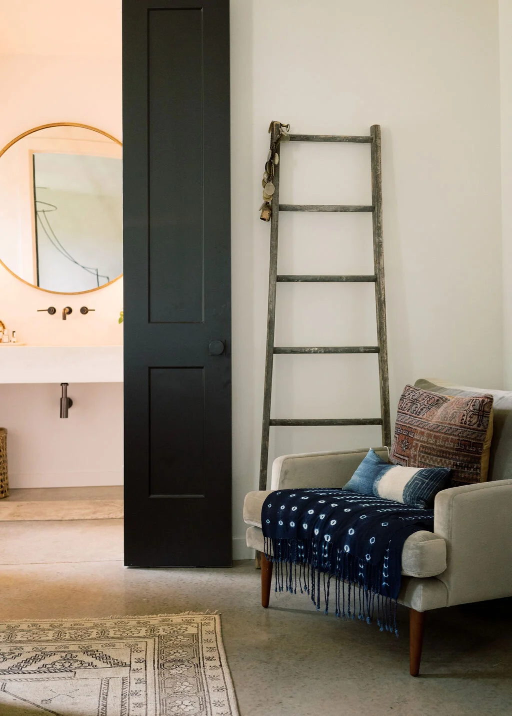 Concrete floors and Persian accents create a warm and inviting aesthetic in your new home. 