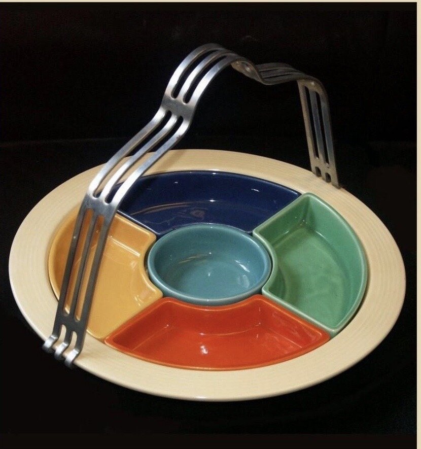  A Fiesta WAre serving dish with five inserts.  All the original colors plus turquiose which was introduced in 1937..  