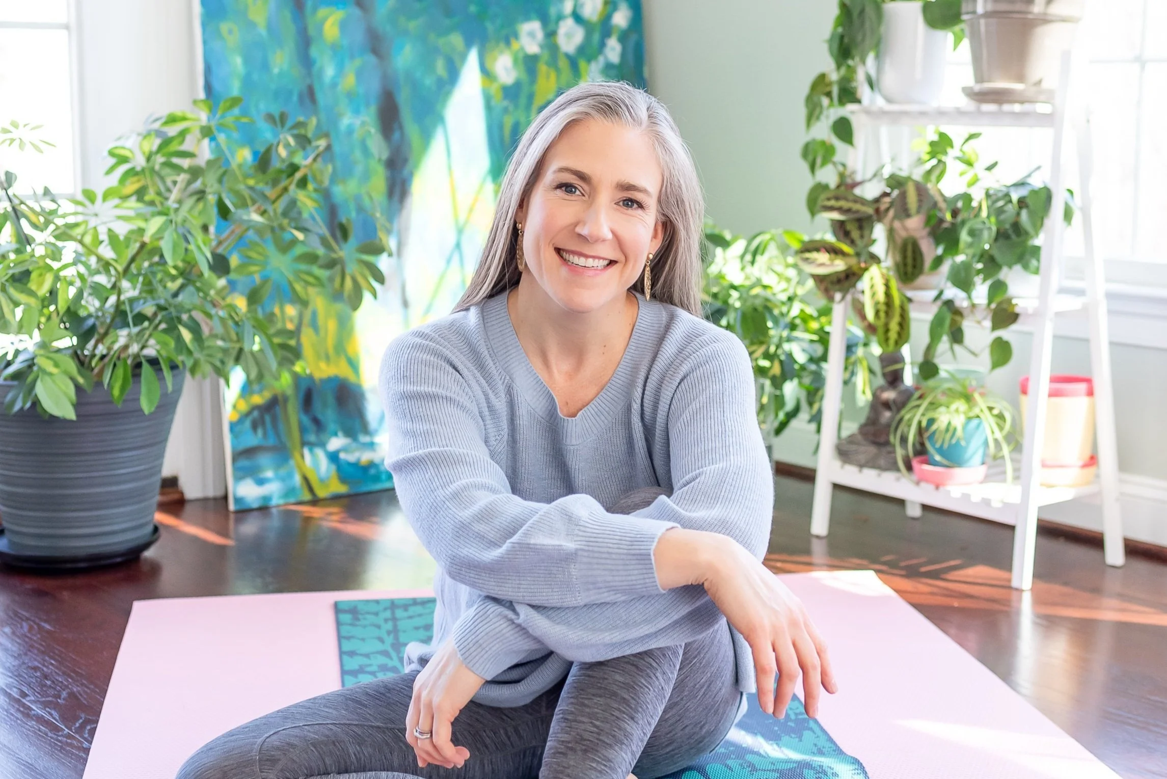 Dr. Meghan Hulver seated on yoga mat