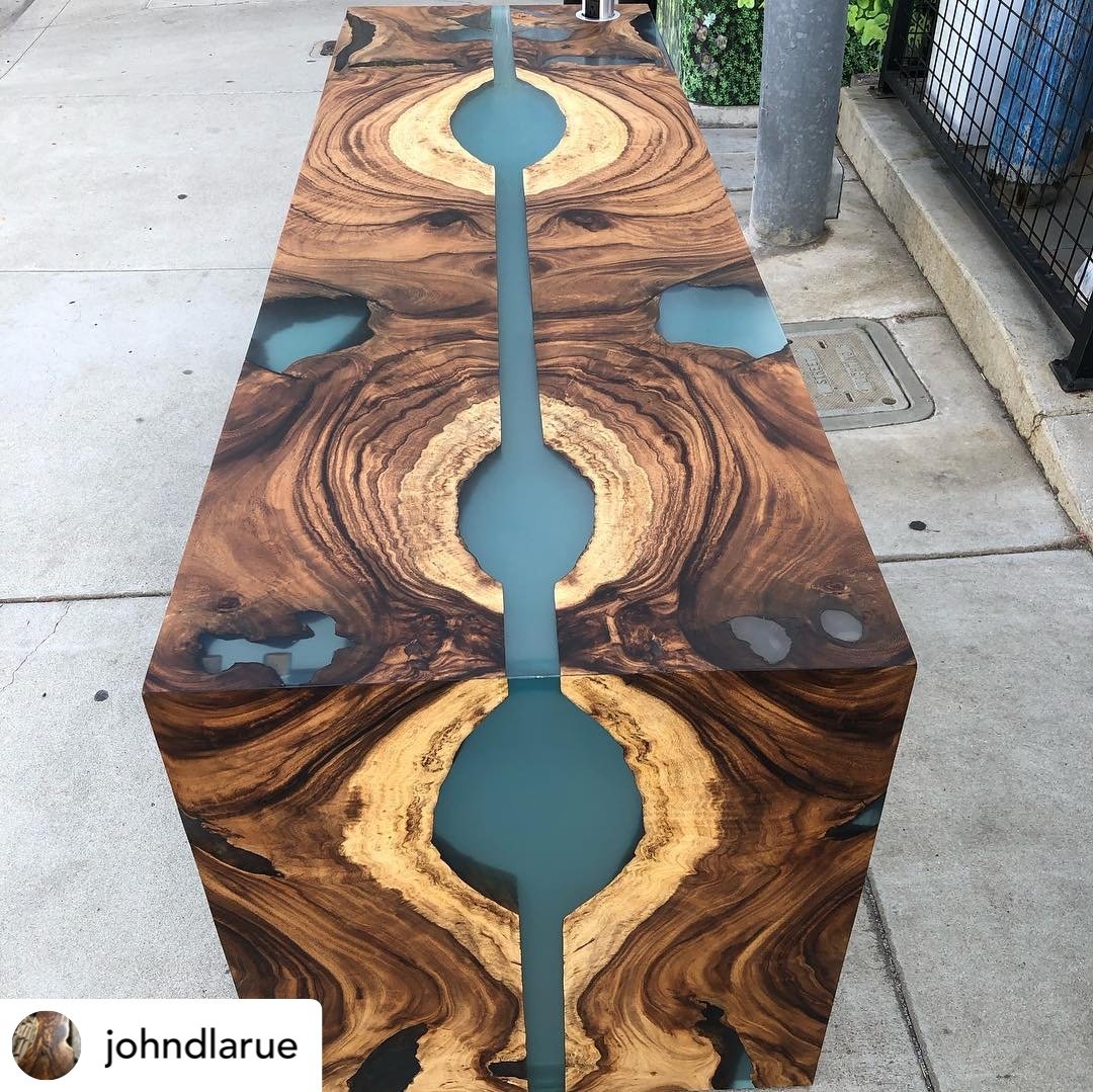 Bookmatched acacia wood slabs with resin for custom dining table in San Diego