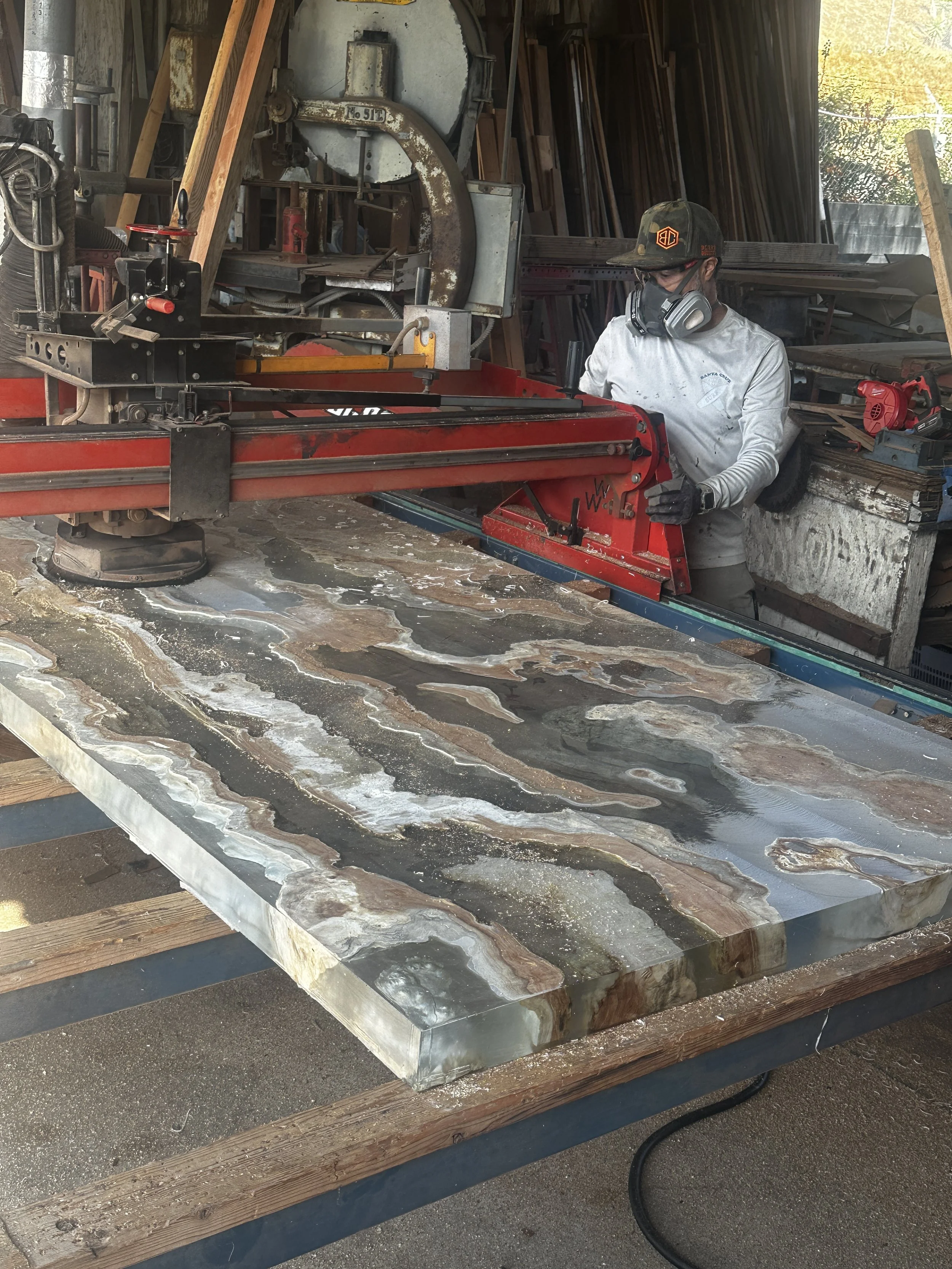 Live edge wood slab being flattened for custom furniture at Indigenous by La Rue in San Diego