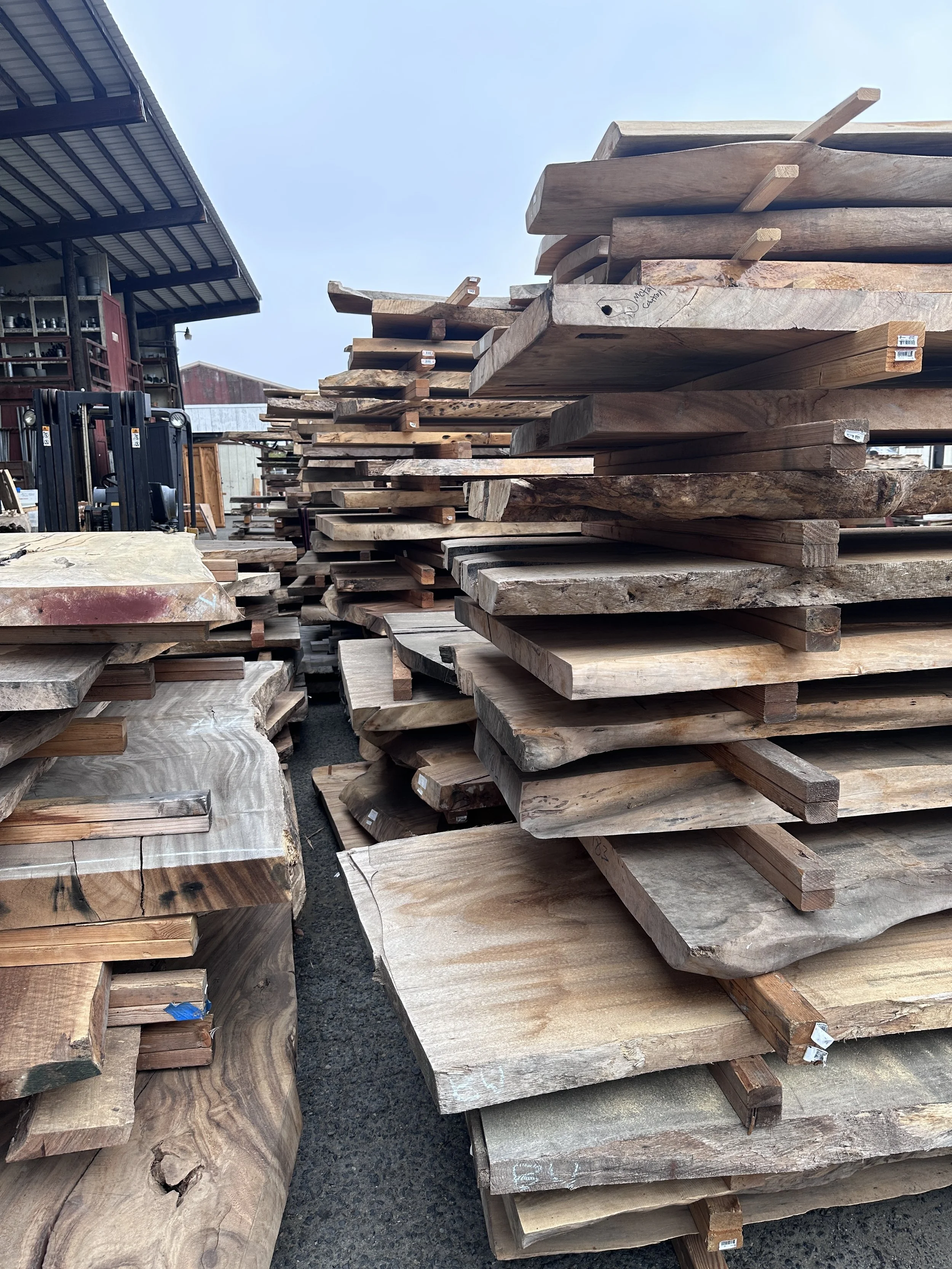 Premium walnut slabs selected for custom furniture and live edge tables for Pacific Palisades homes
