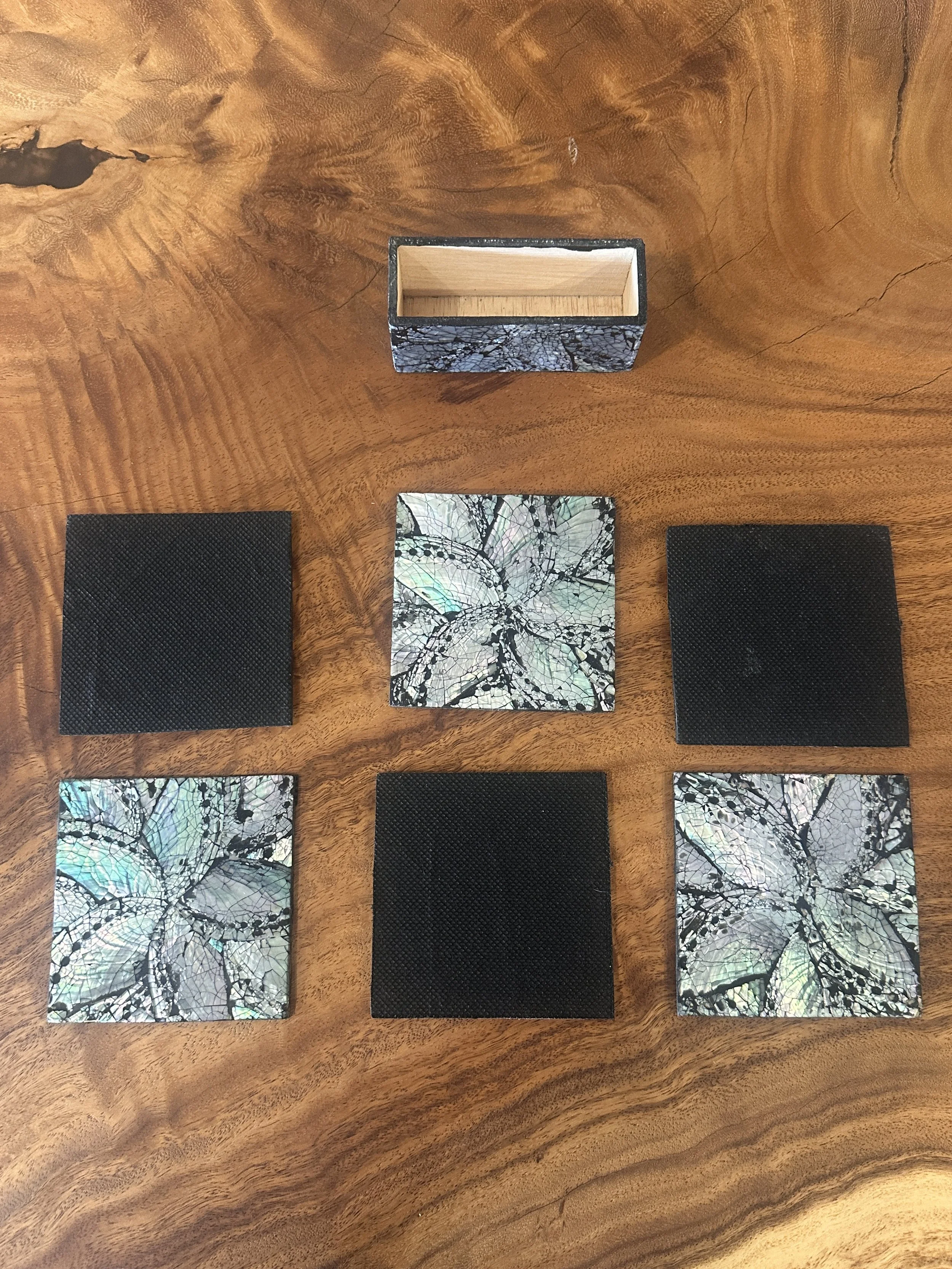 Black mother of pearl coasters.JPG