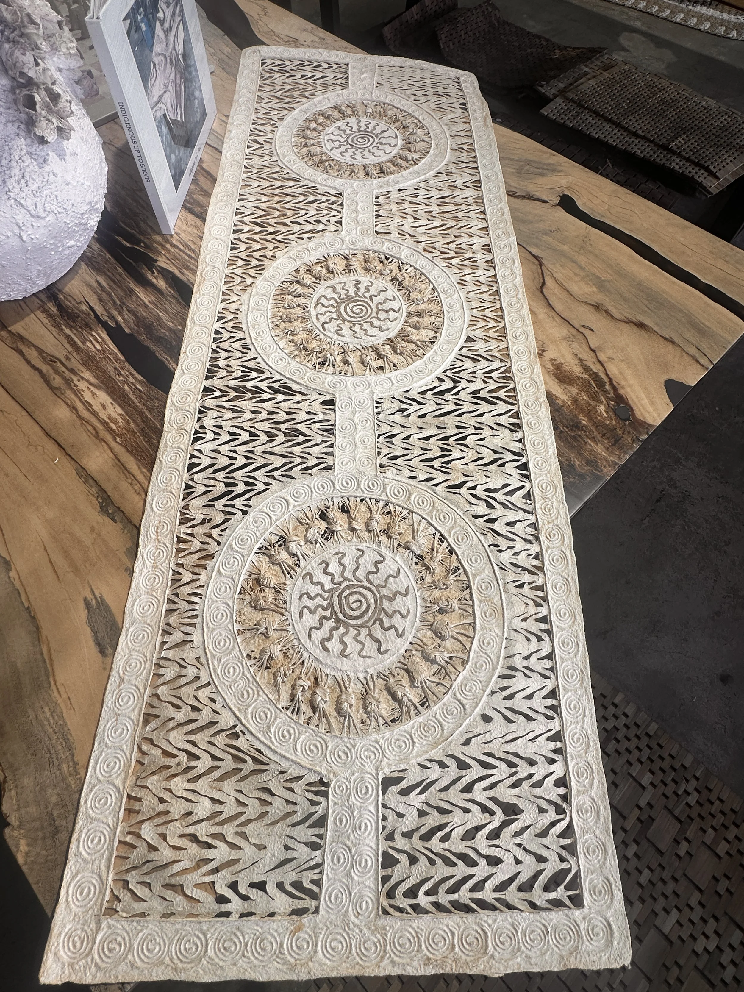 bone whit amate with triple sun motiff.JPG
