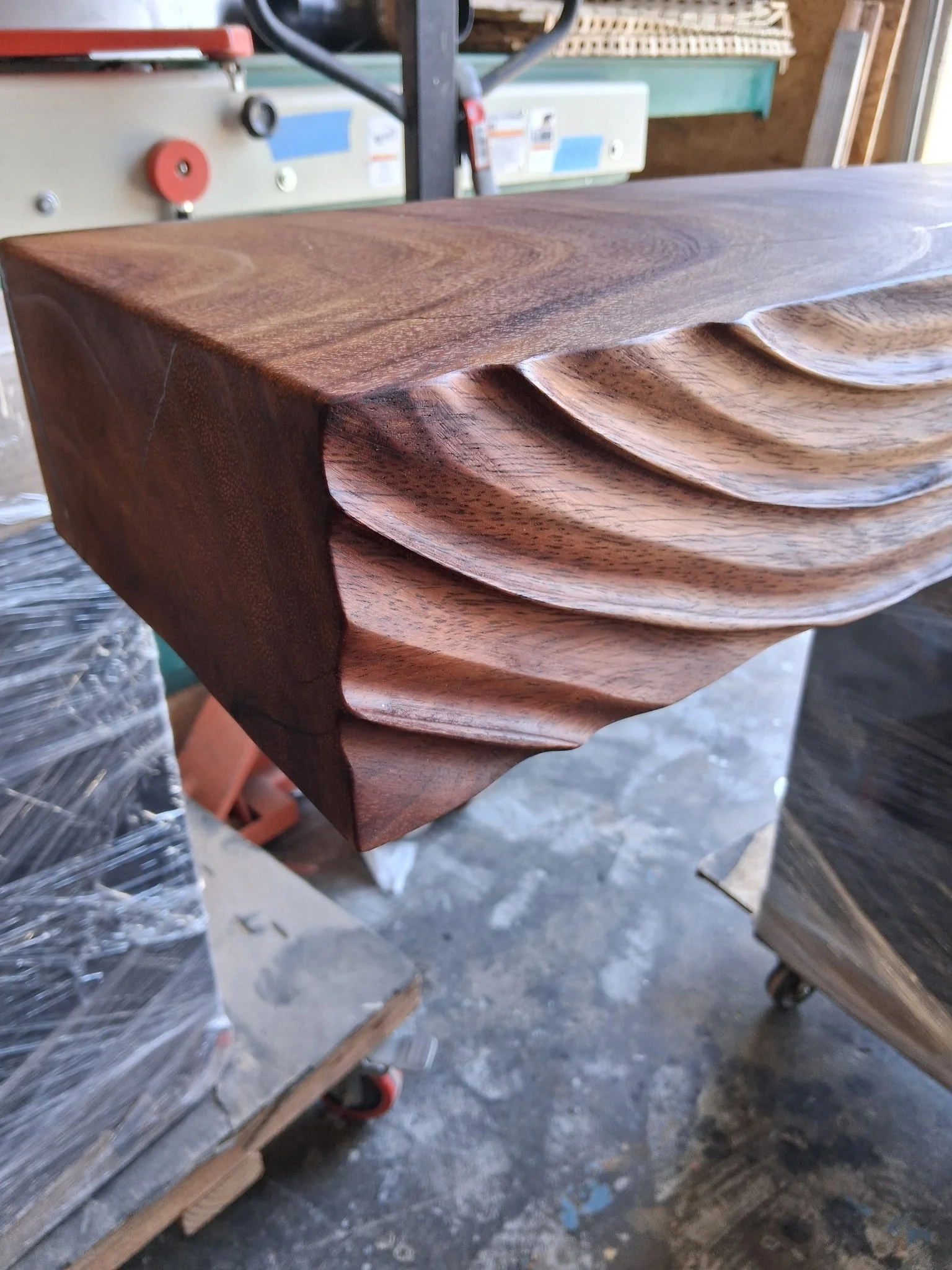 Natural wood grain and hand carved detail on a Dining table.