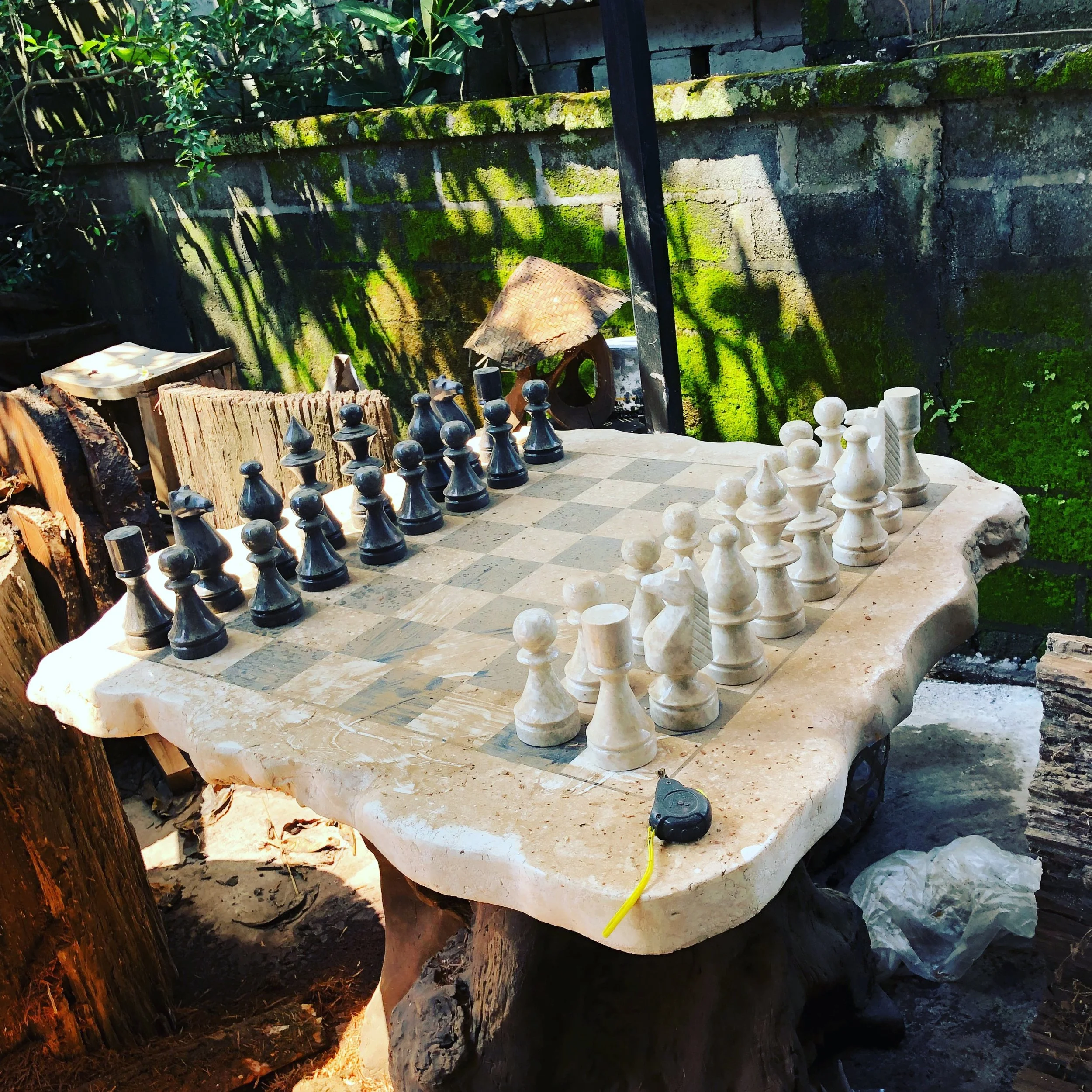 Outdoor chess set on a rustic table