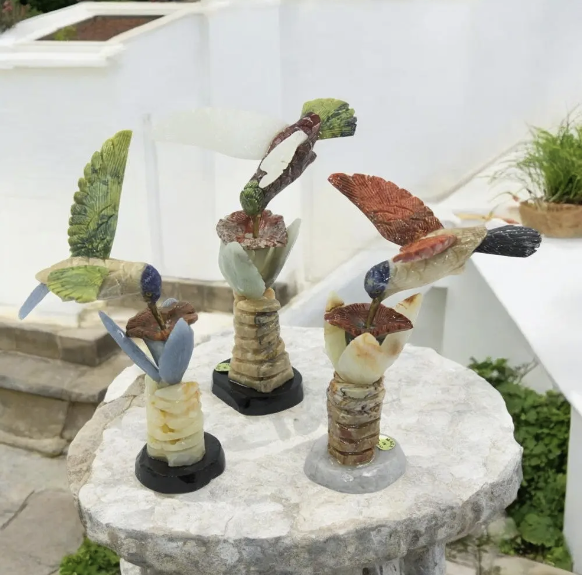 Hand Carved Hummingbird stone.png