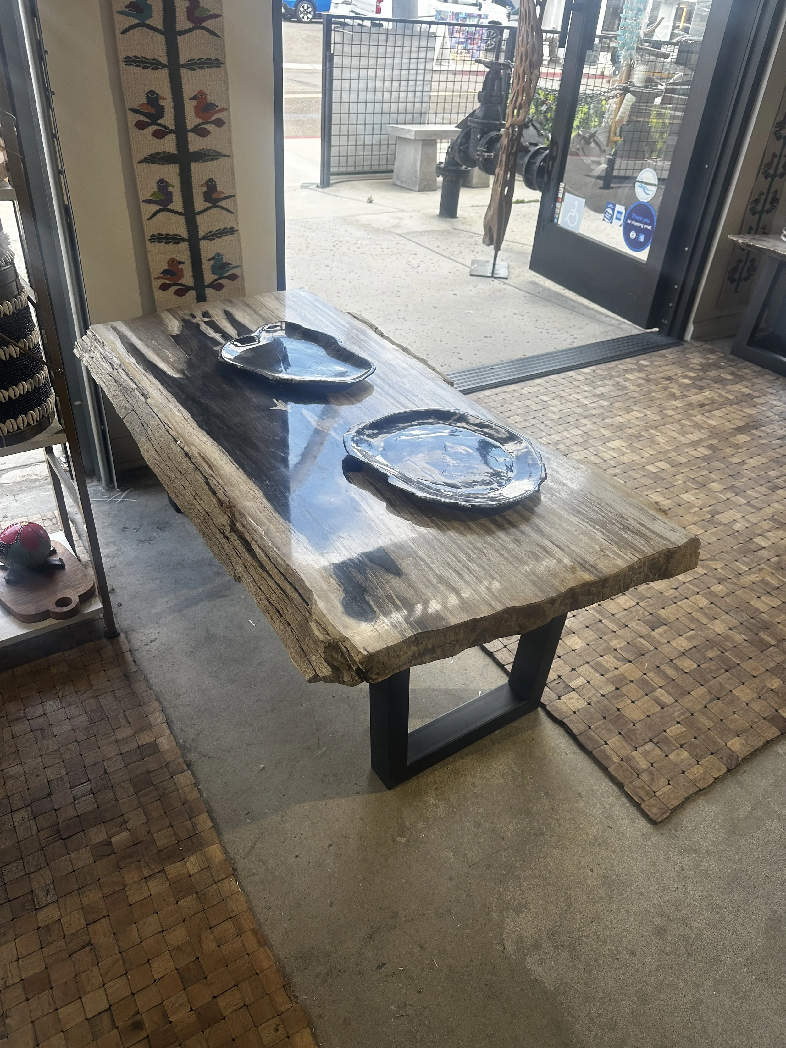 Petrified coffee table with textured edges.JPG