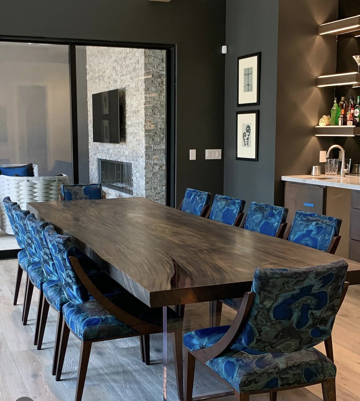 Natural wood live edge dining table with custom seating in Scottsdale home.