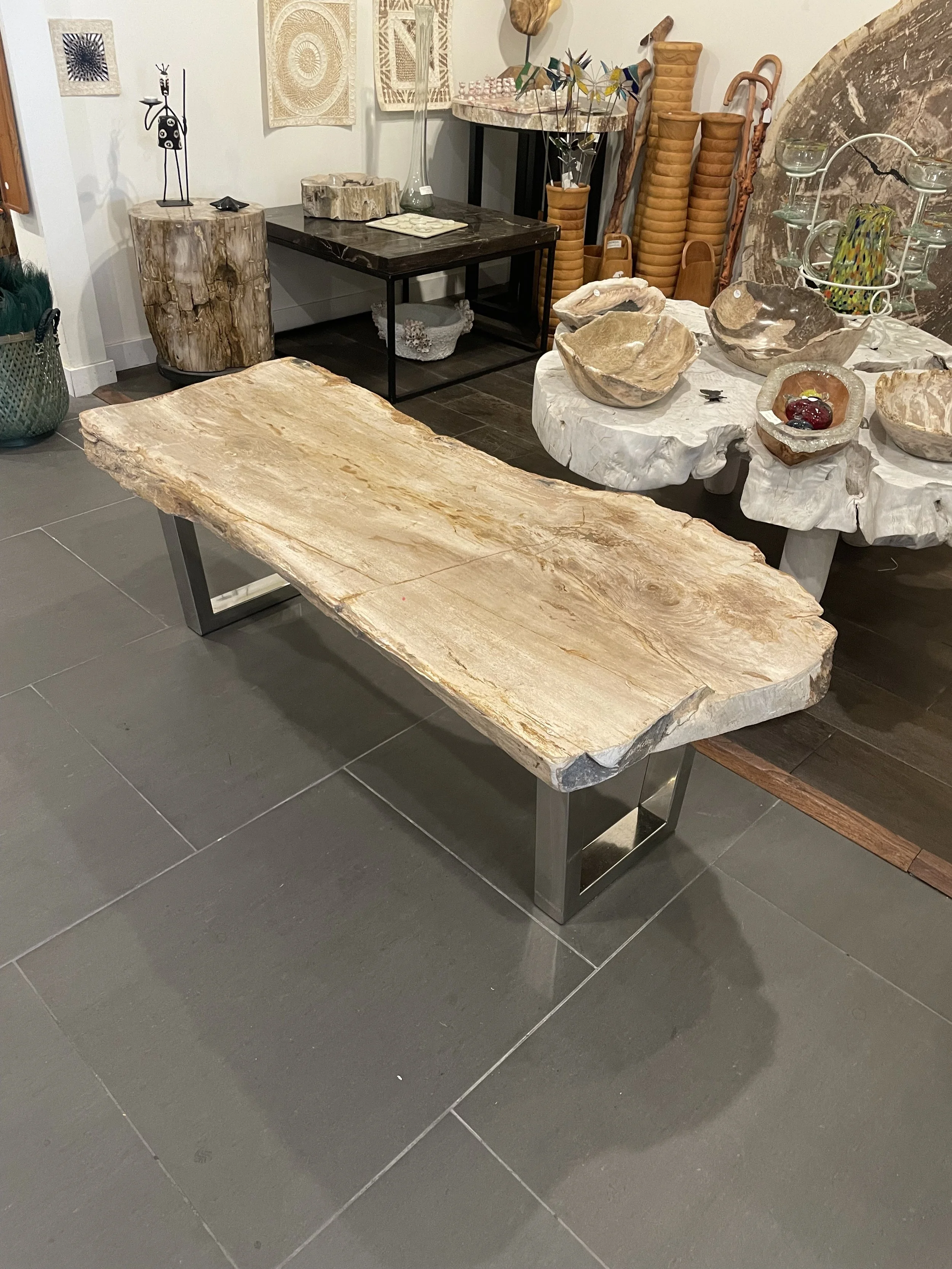 Petrified coffee table neutral on stainles base.jpeg