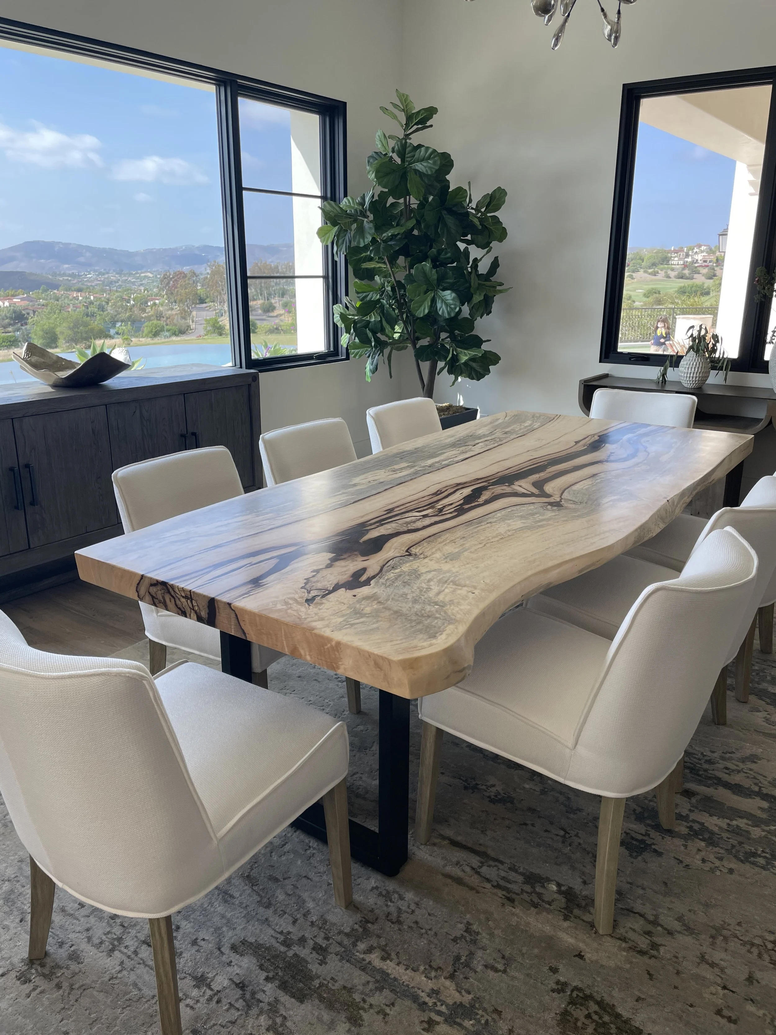 Custom live edge dining table in a luxury Solana Beach , CA home.