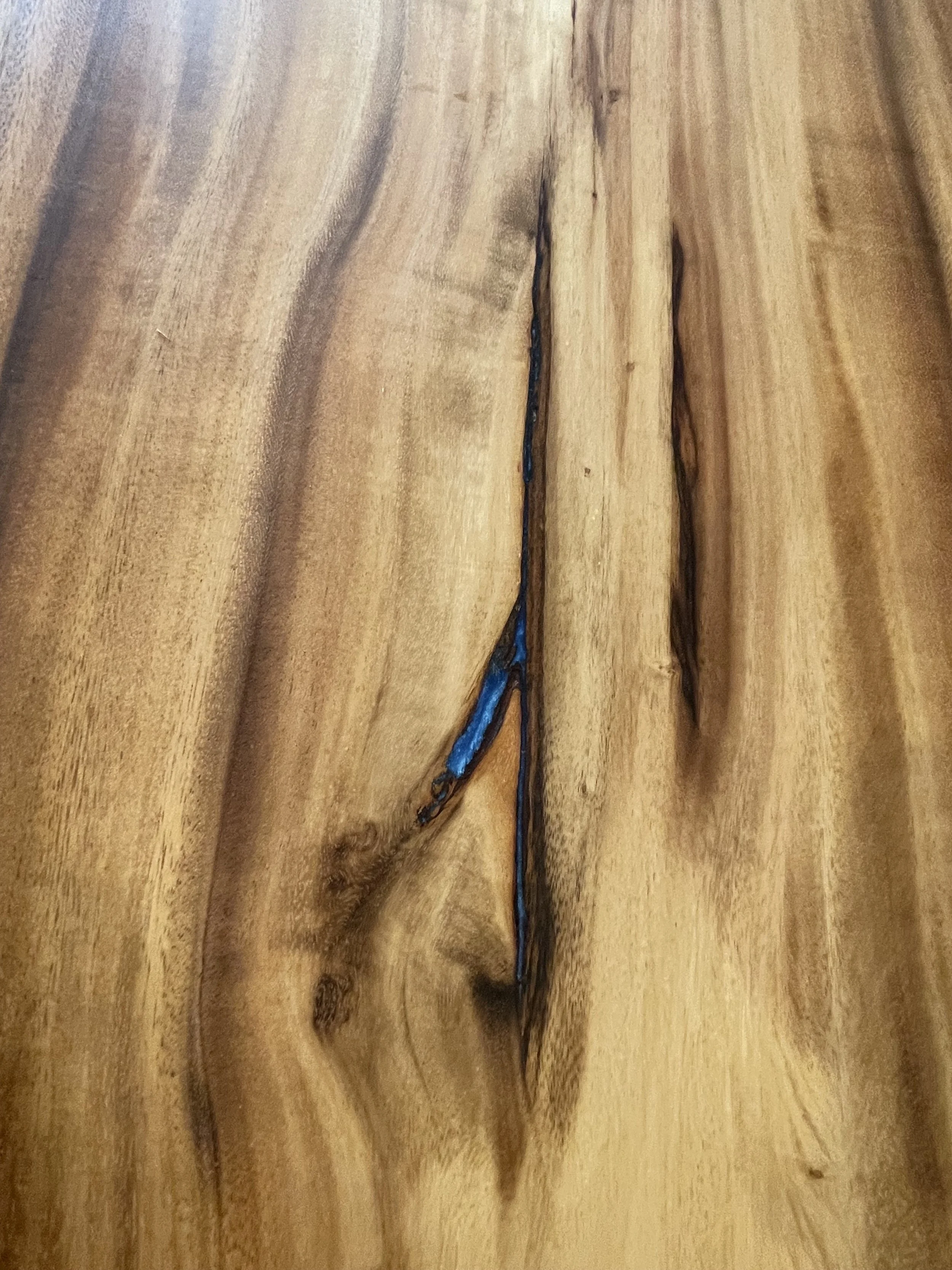 End view of acacia table epoxy blue reain .jpeg