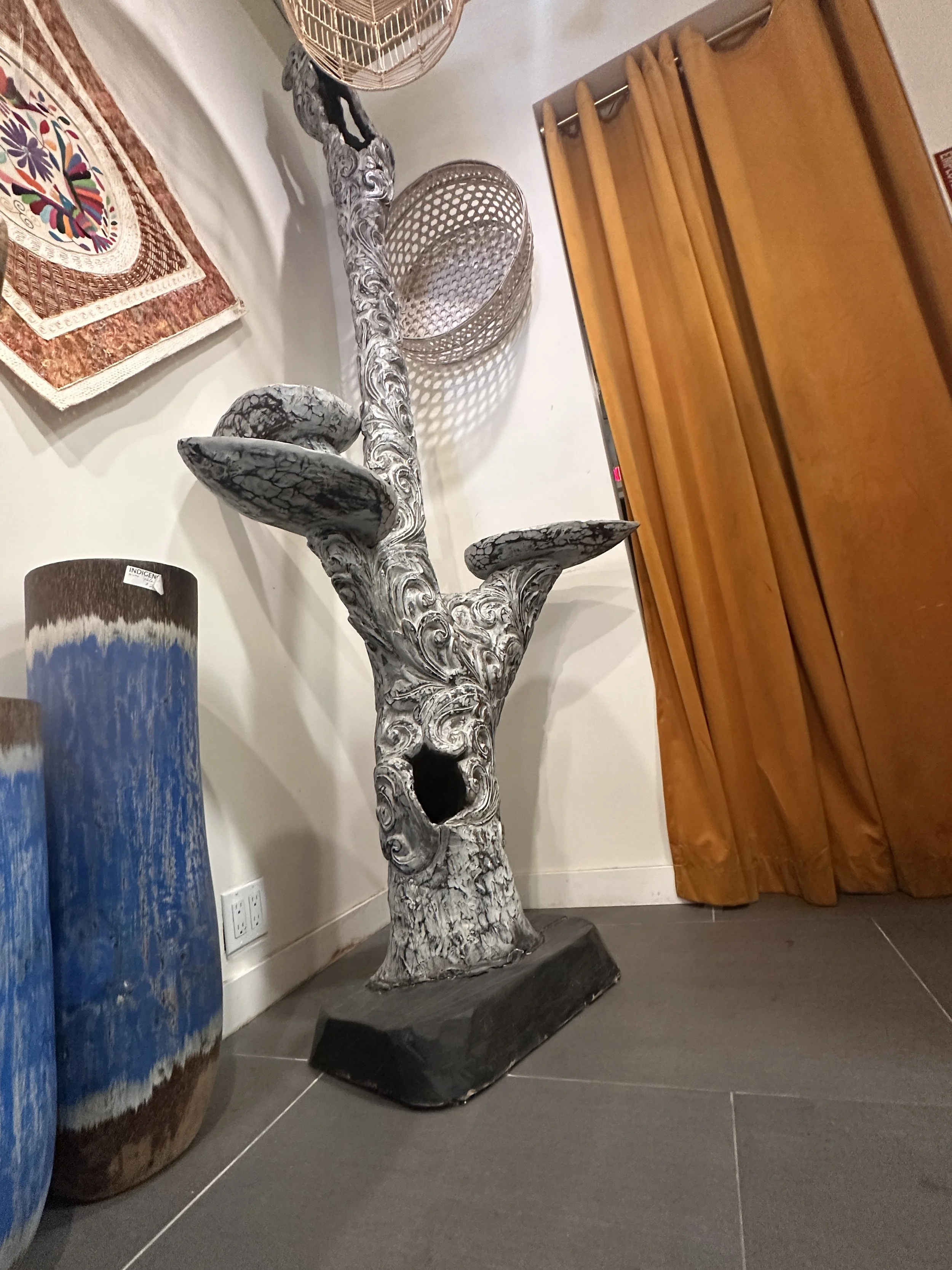Gray carved tree sculpture.JPG