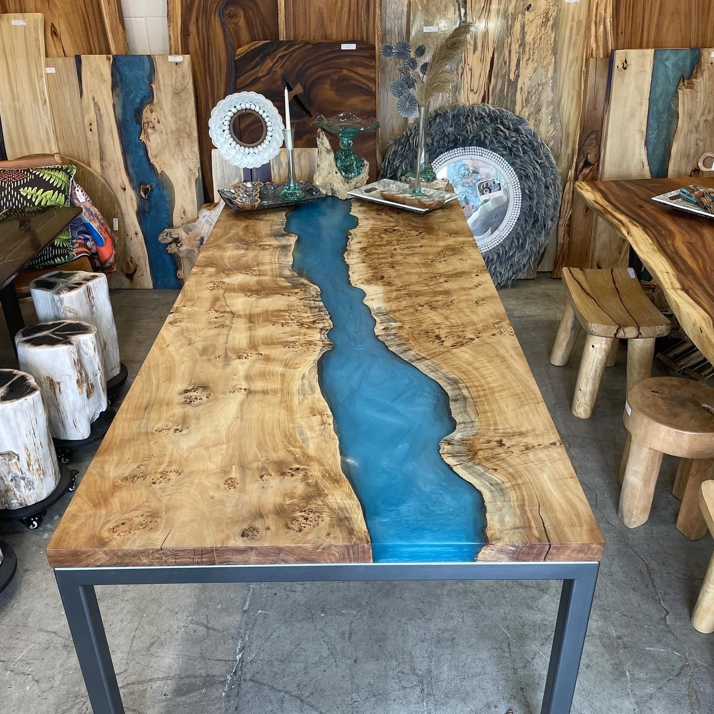 Custom Live edge Mapa burl table made into a river table with blue epoxy resin