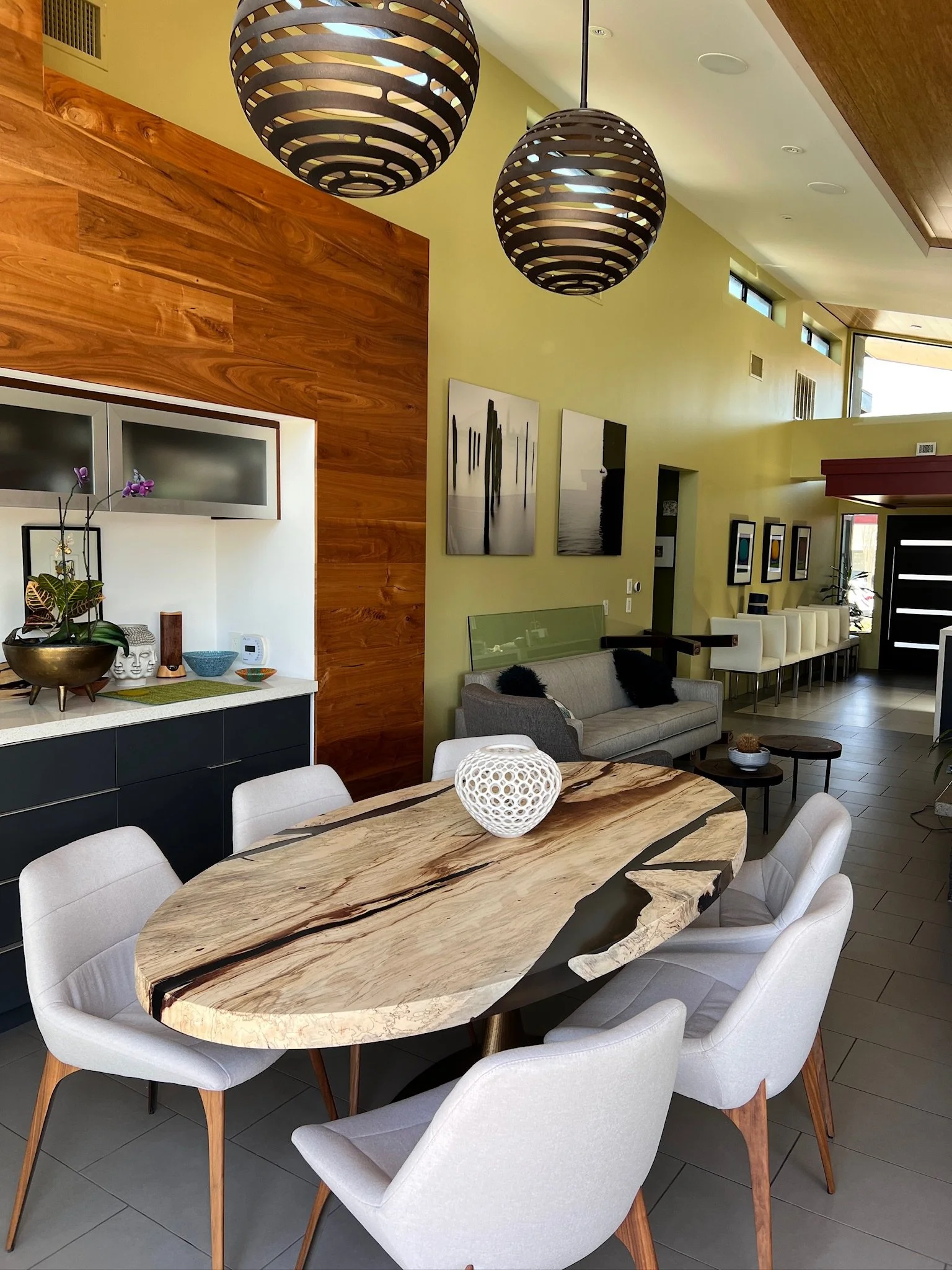 Custom live edge oval dining table in a contemporary Dallas, Texas home by Indigenous by La Rue