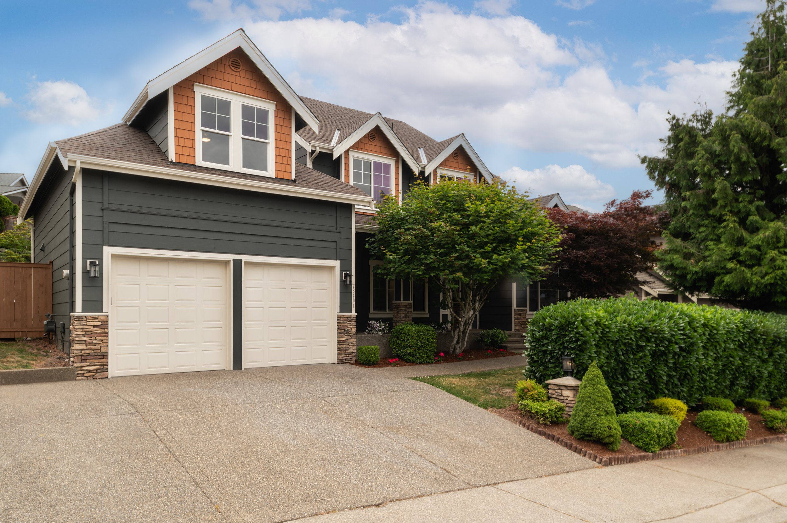 Exterior shot of a modern home with sky replacement in Auburn by Seattle real estate photographer Gavin Haag