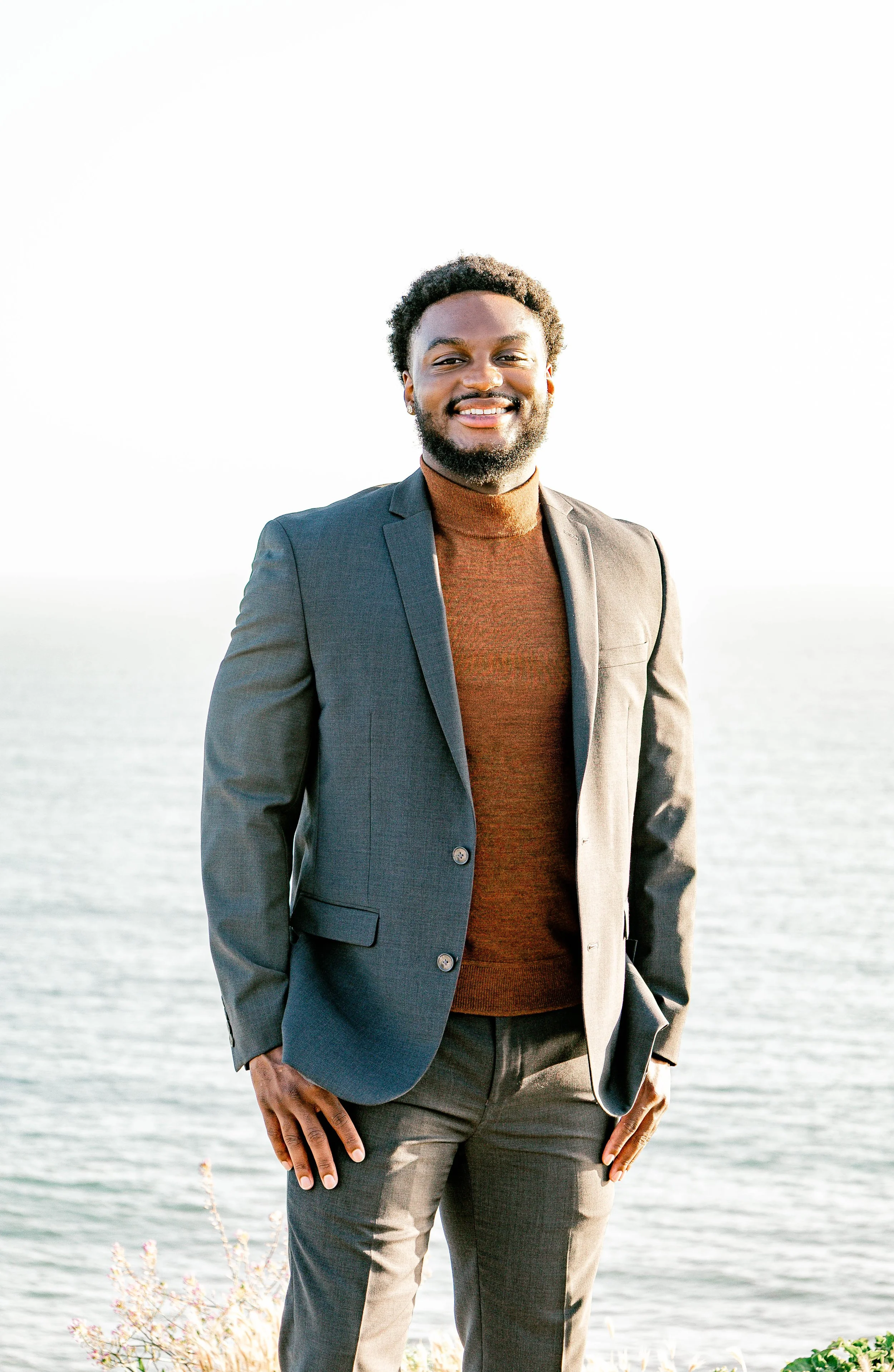 College gradate smiles at camera with ocean in the background, San Pedro, California.jpg