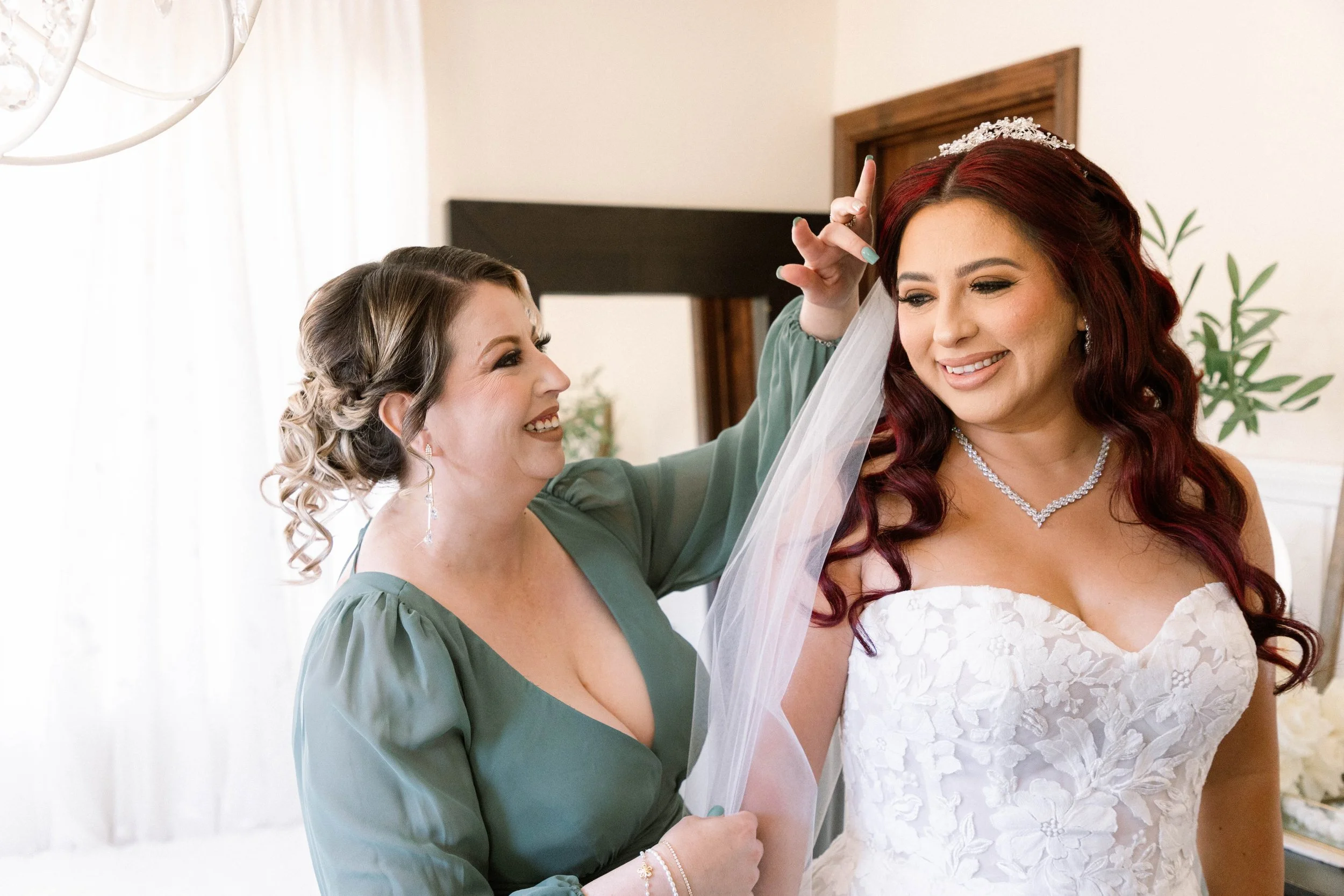 oak-glen-serendipity-garden-weddings-maid-of-honor-helps-bride-get-ready.jpg