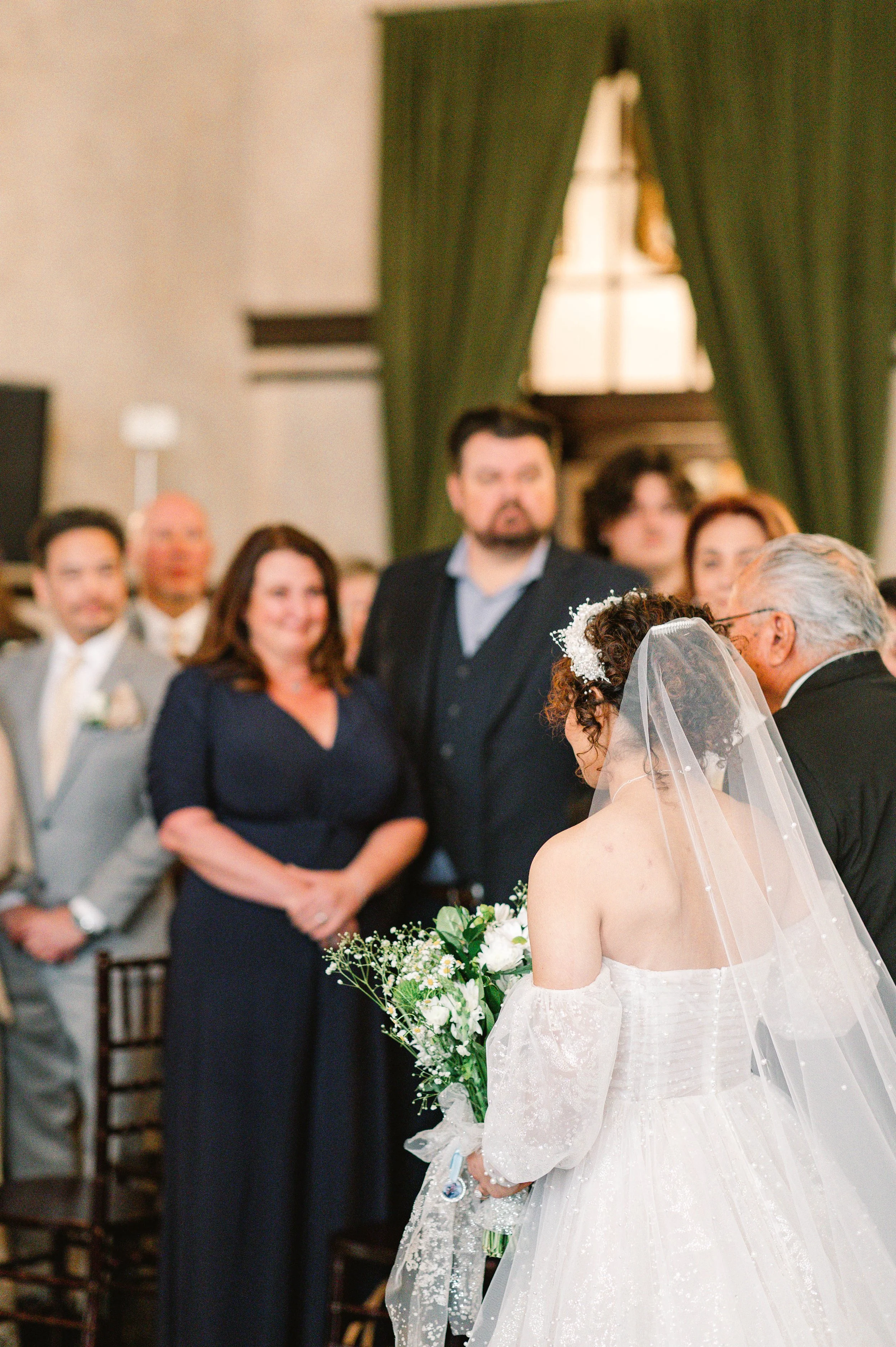 loft-84-riverside-wedding-ceremony-bride-walks-down-aisle-with-grandfather.jpg