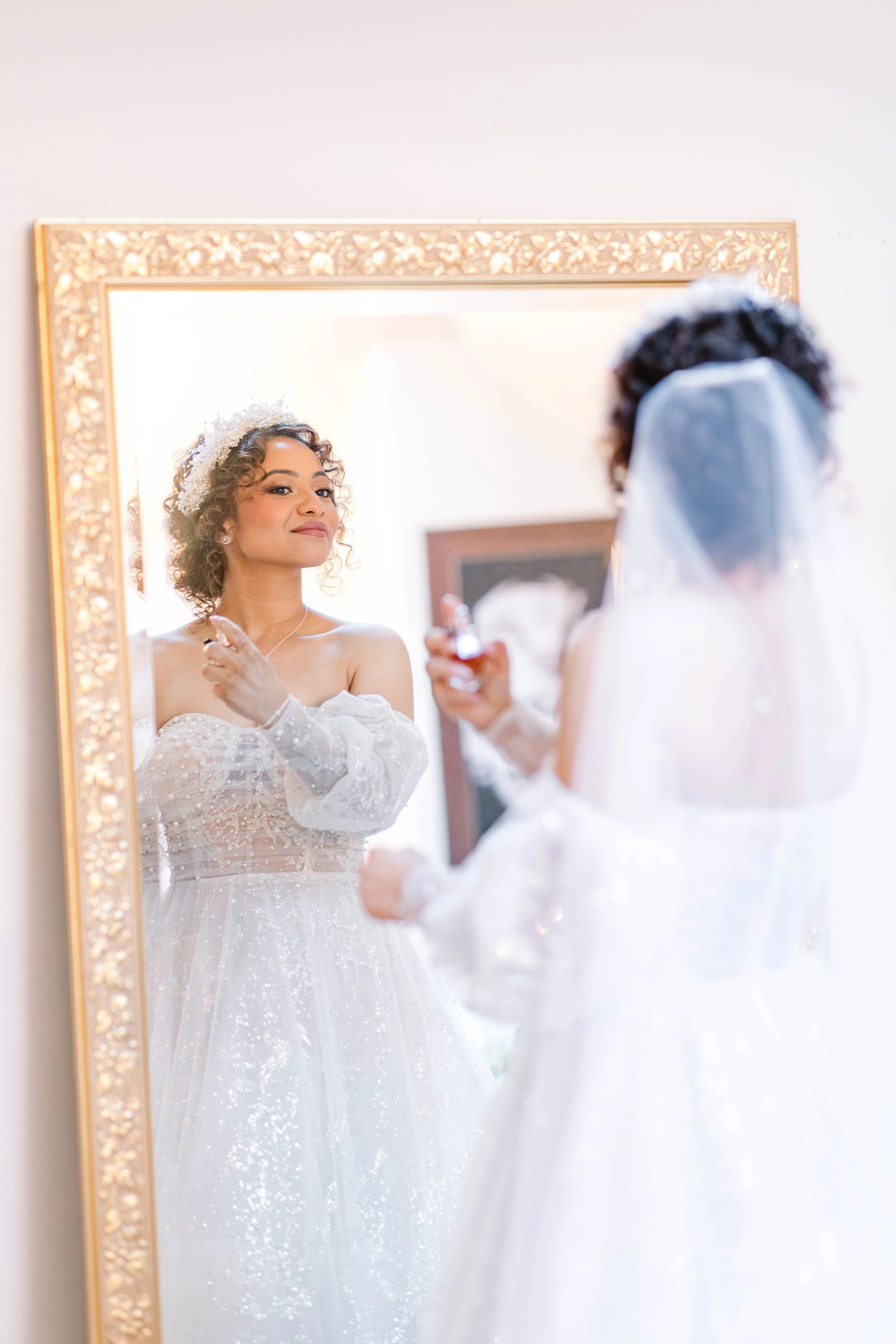 loft-84-wedding-bride-getting-ready-in-front-of-mirror.jpg
