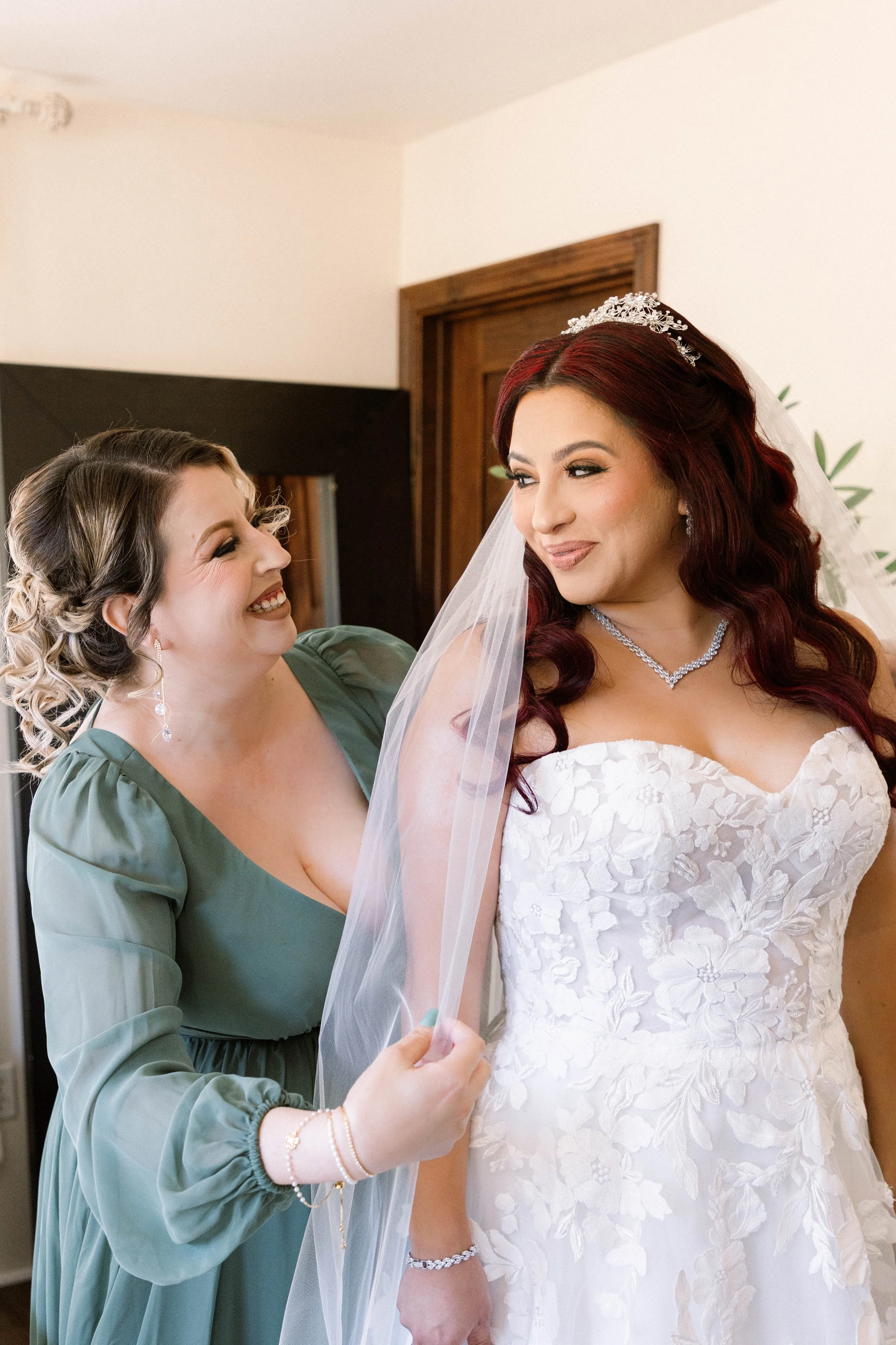 oak-glen-serendipity-garden-weddings-maid-of-honor-helps-bride-get-ready.jpg