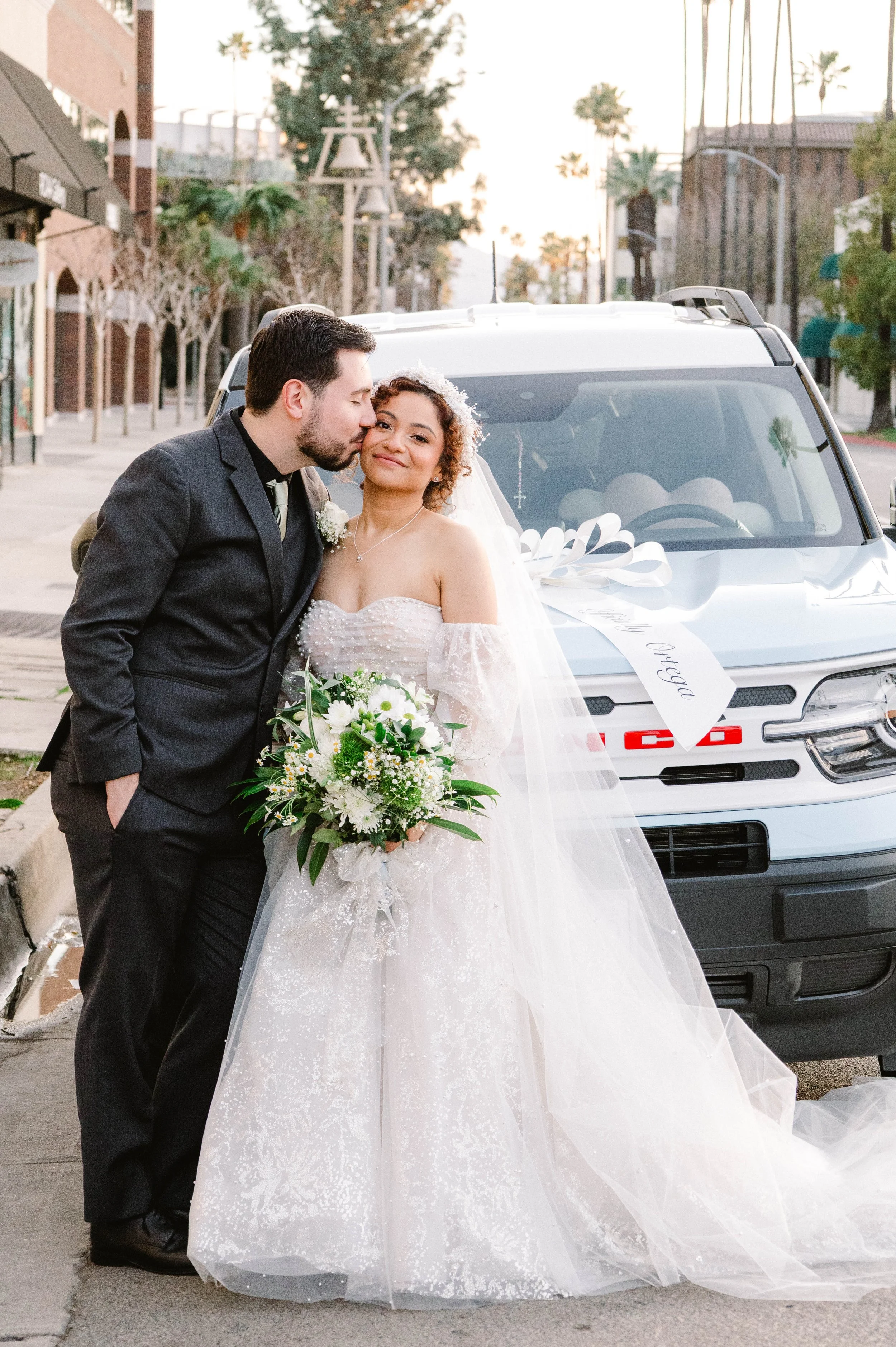 downtown-riverside-wedding-couple-getaway-car.jpg