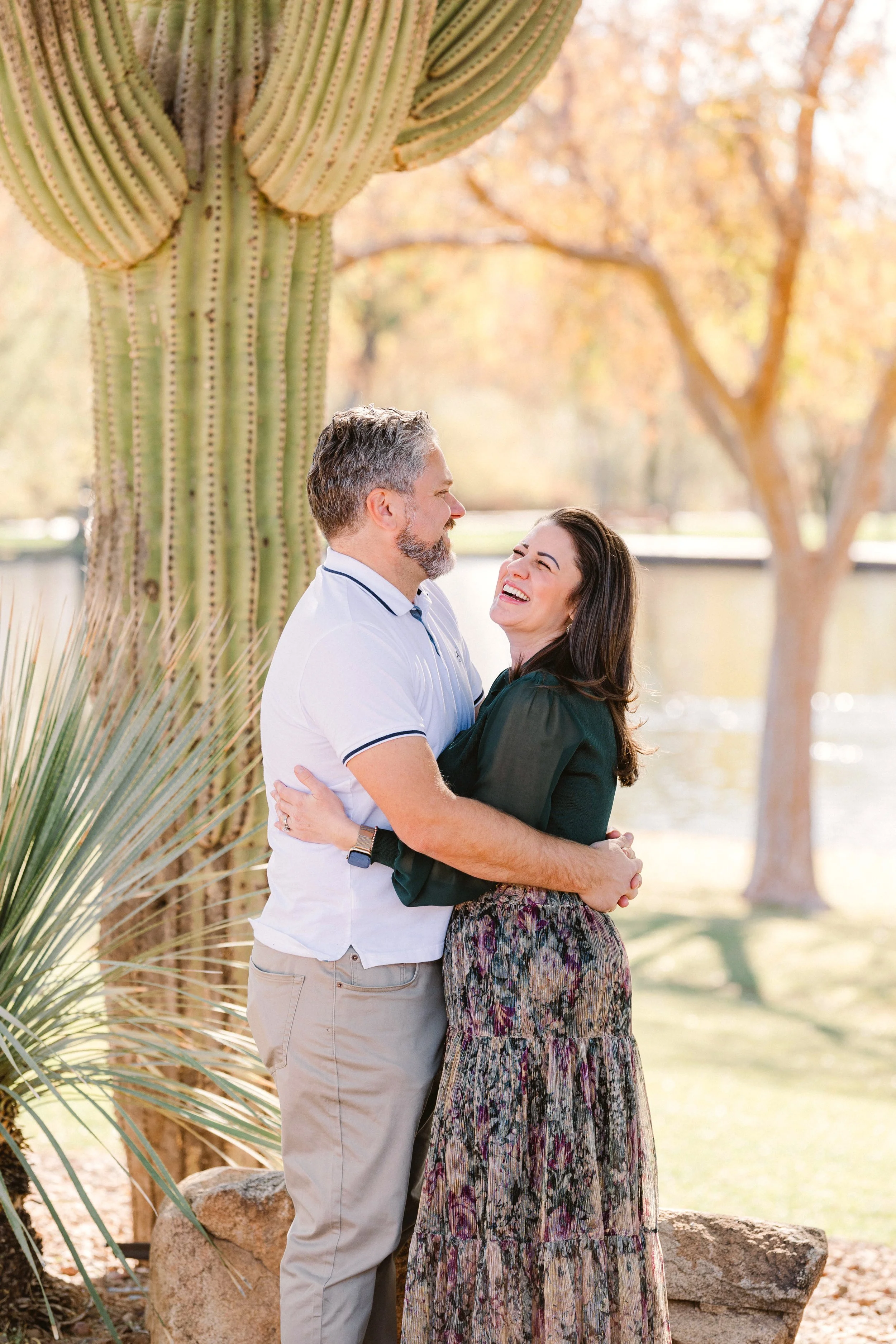 anthem-arizona-family-session-parents-laugh-playfully.jpg