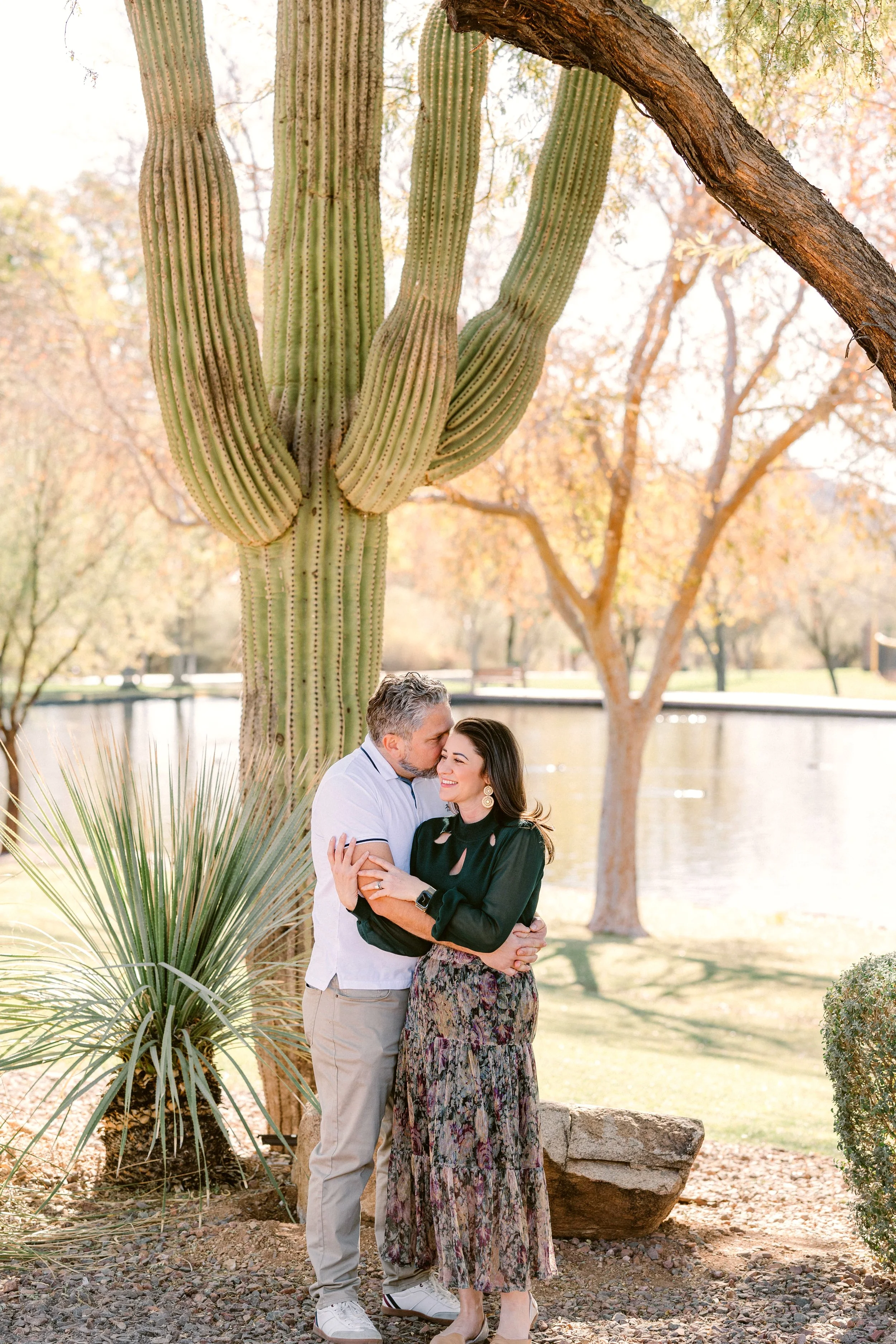 anthem-arizona-family-session-parents-embrace-near-cactus.jpg