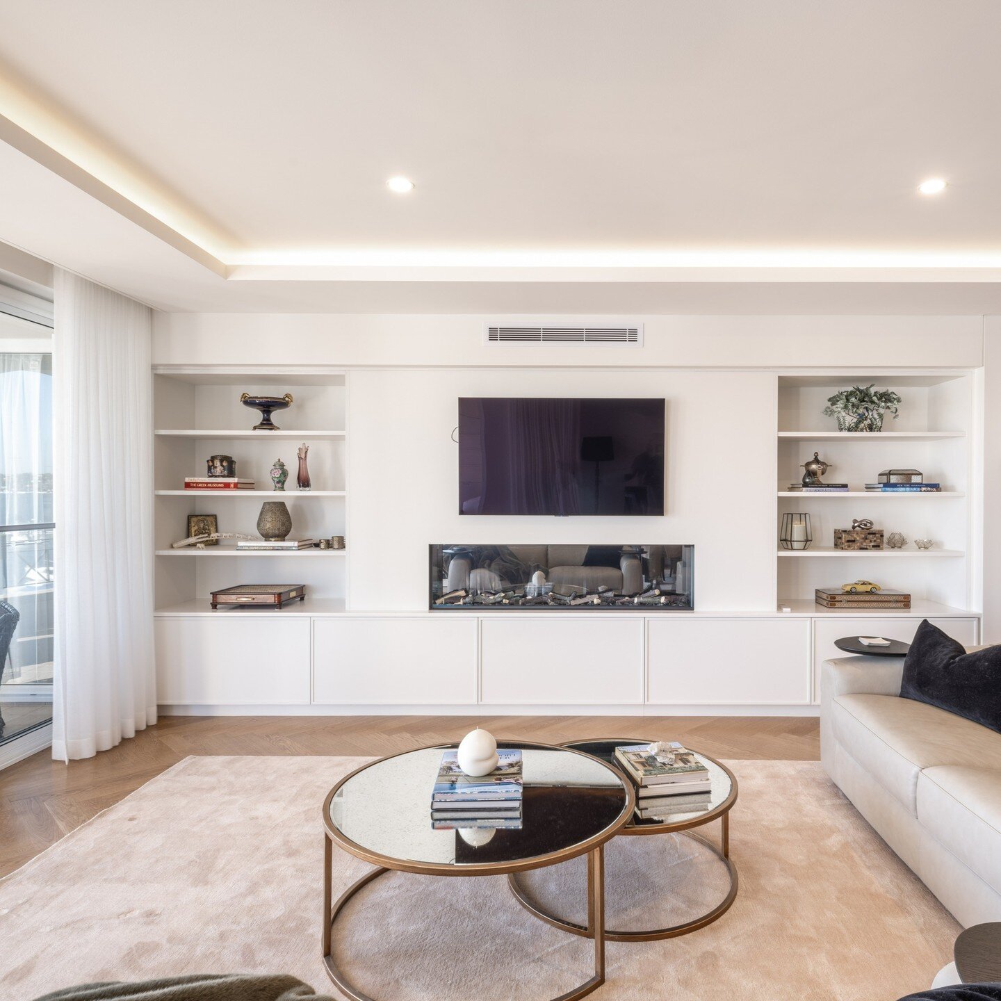 New living room with built-in joinery and fireplace for this penthouse renovation in Balmain. 
#homerenovation #penthouse #interiordesign #fireplace #joinery #lighting #architectdesign #homedesign #livingroom #homedecor #balmain #sydneyhomes