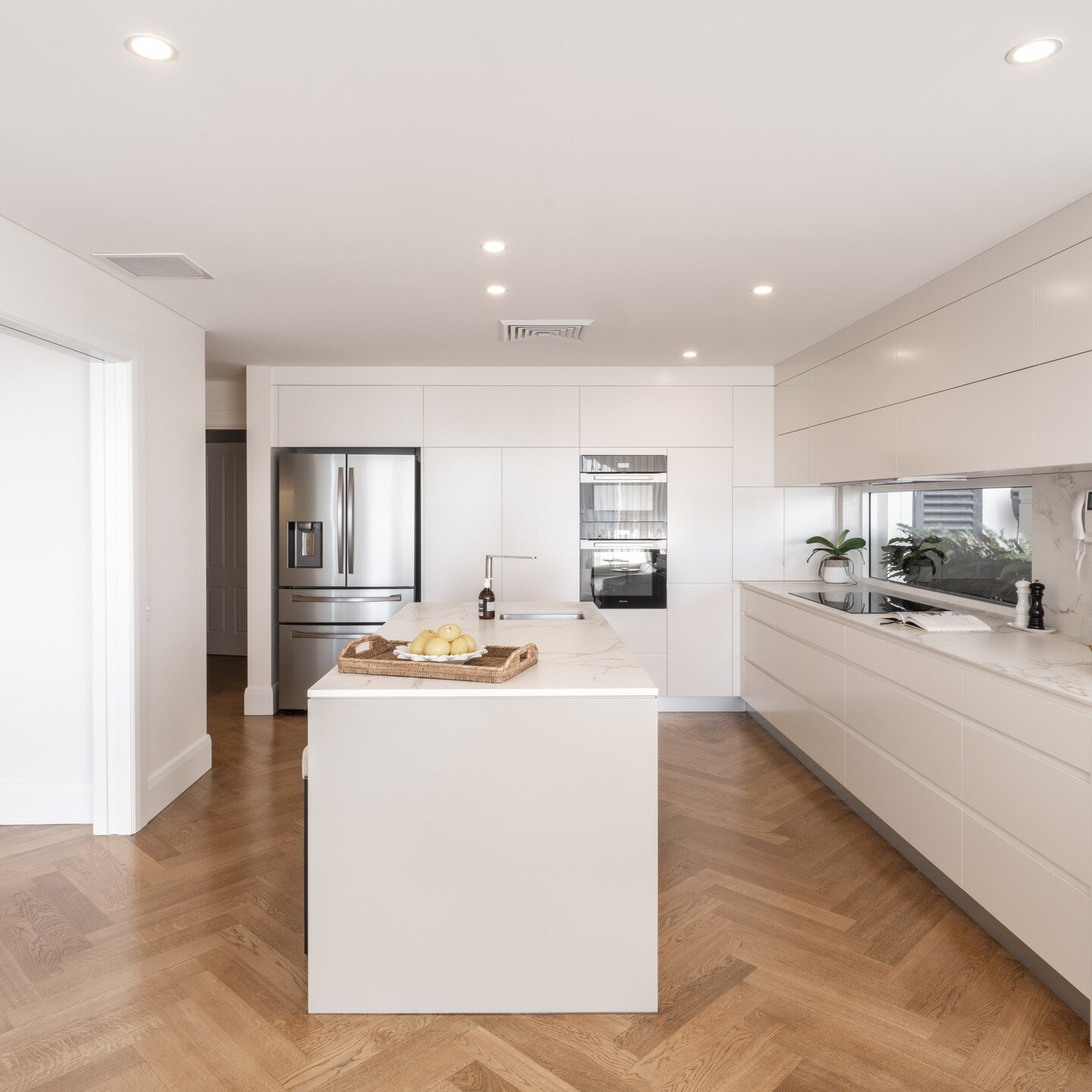 New kitchen -Penthouse reno-Balmain 
The kitchen area was opened up to create an island for the family to congregate around. 
#homerenovation #penthouse #interiordesign #joinery #architectdesign #kitchen #kitchendesign #balmain #sydneyhomes 
Floors b