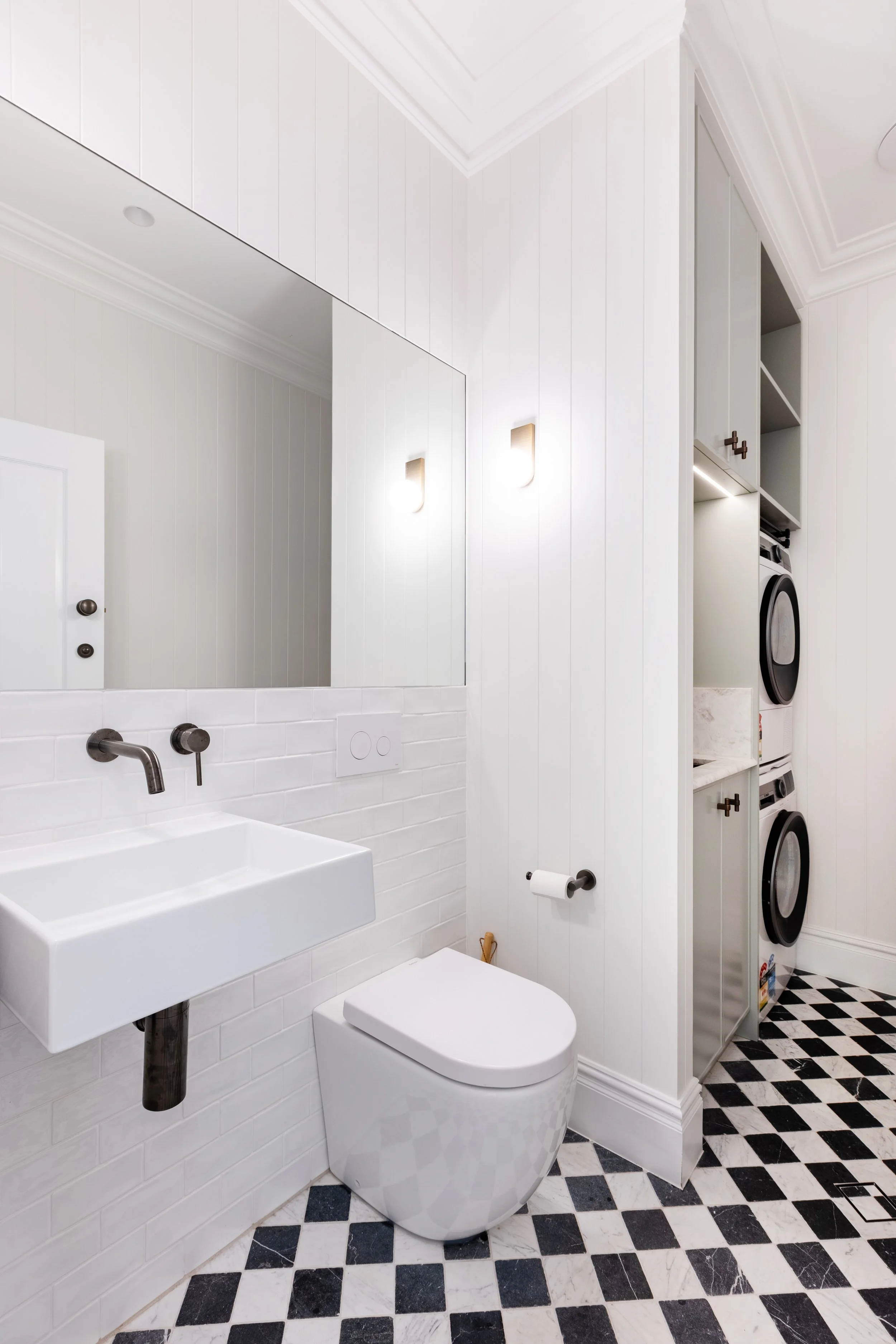 Combined powder room and laundry