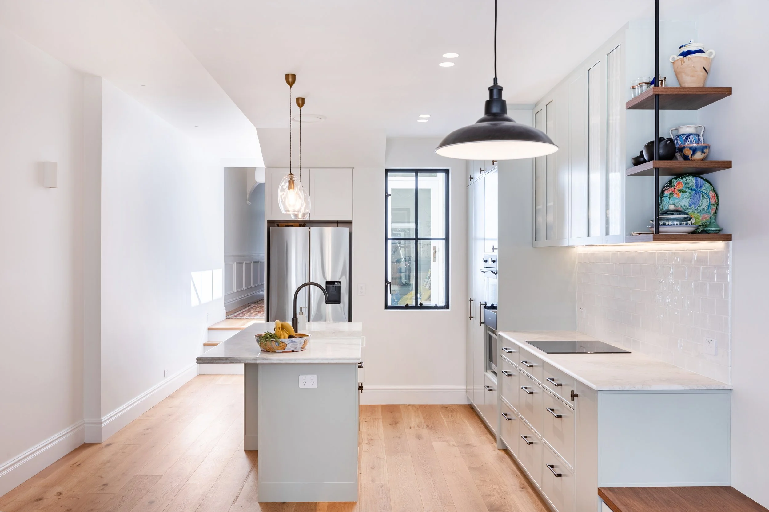 Hamptons style kitchen with timber floor