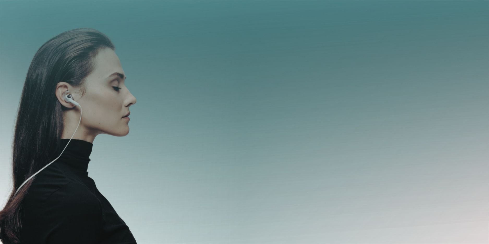 Woman with eyes closed and headphones in ears in a calm moment, used as hero image for anxiety therapy for high-achieving women